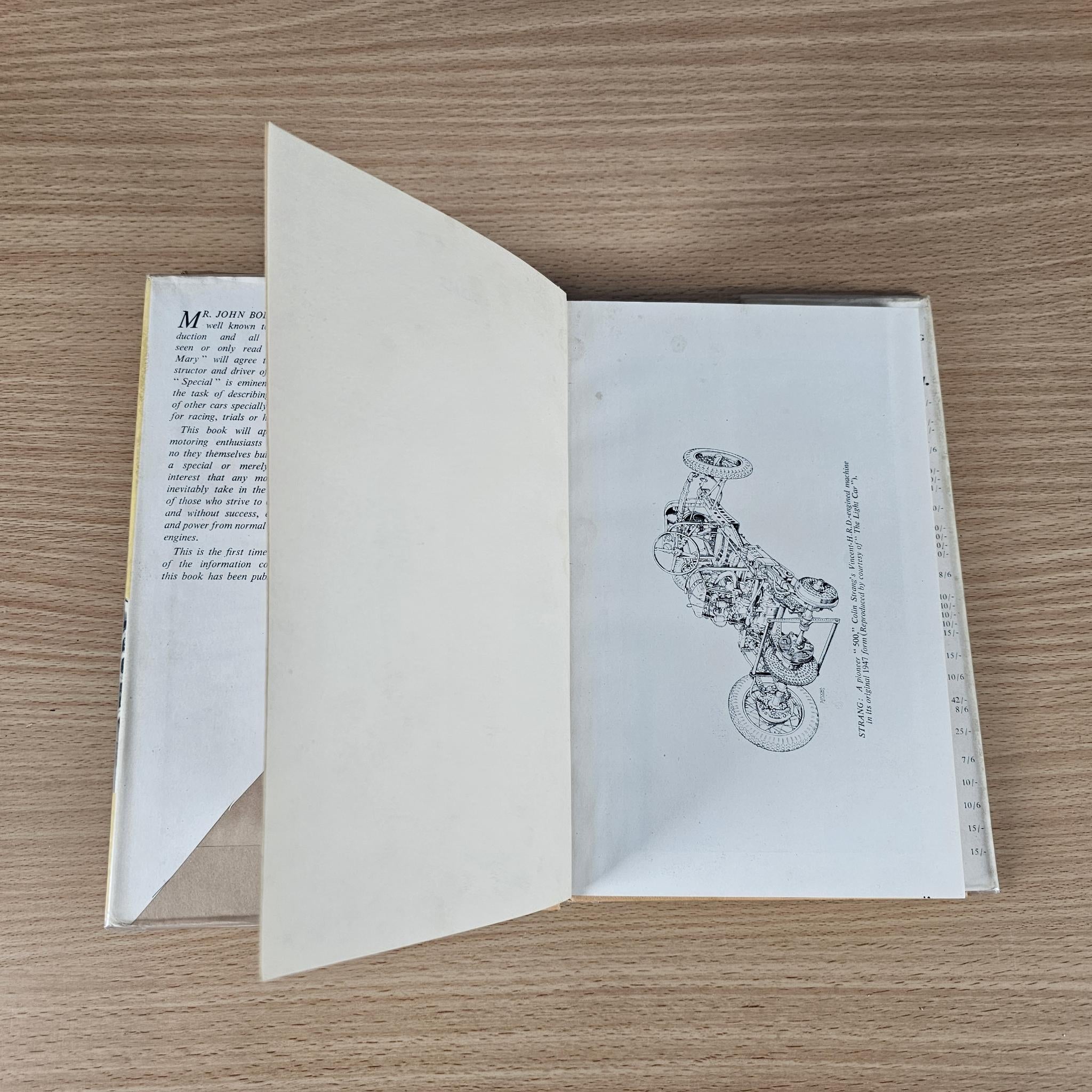 Open racing book with left text page and right illustration diagram of a vehicle