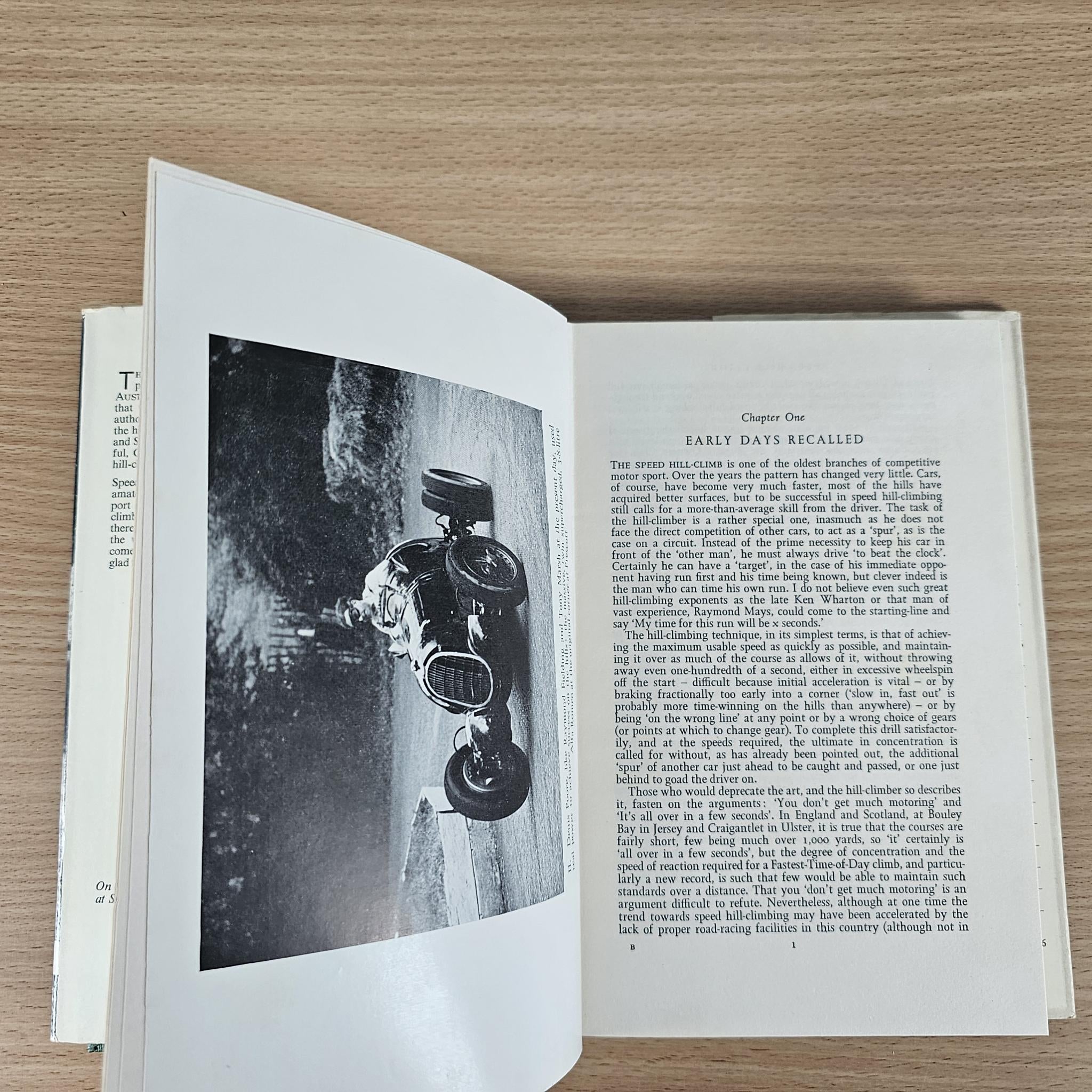 Open vintage book pages featuring a black-and-white racing photo and “EARLY DAYS” text