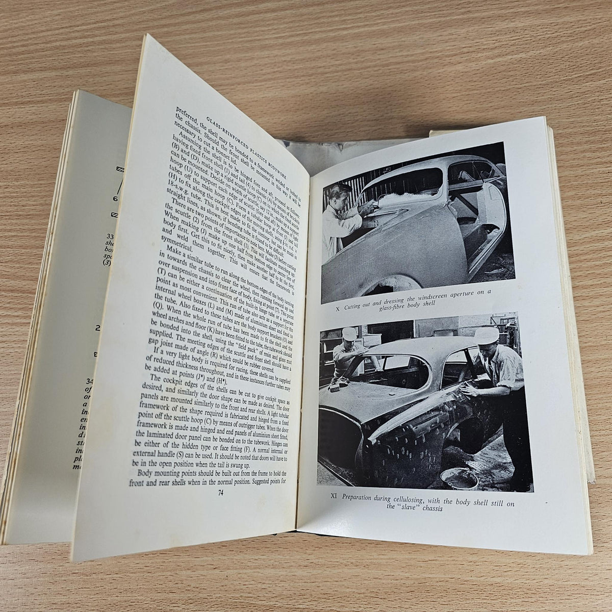 Sports Car Bodywork book open with dense text and black-and-white bodywork construction photos.