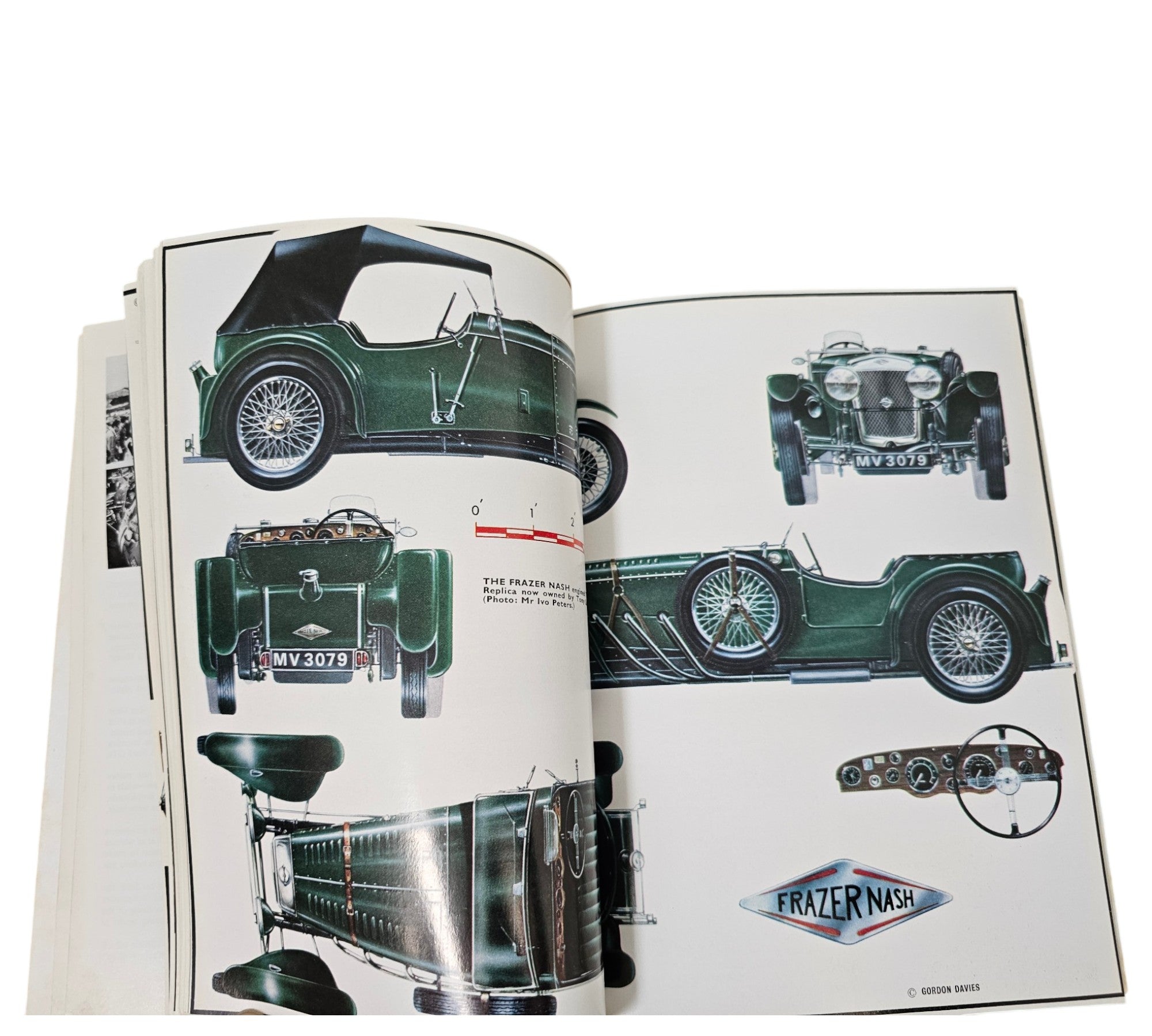 Open book pages featuring a dark green classic car and parts labeled Frazer Nash.
