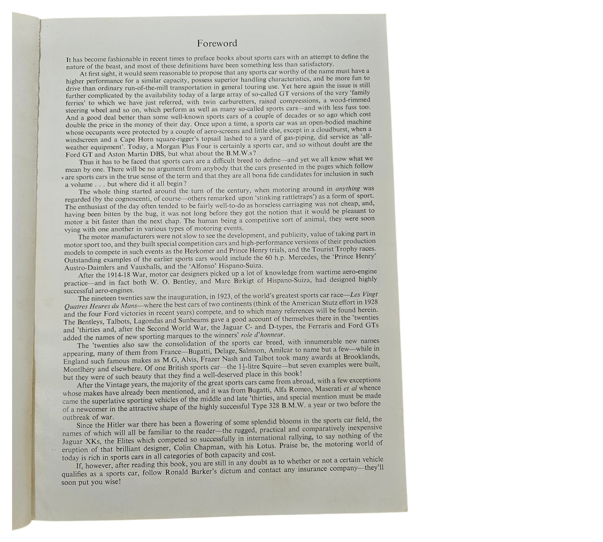 Open book page with dense printed text on white paper.