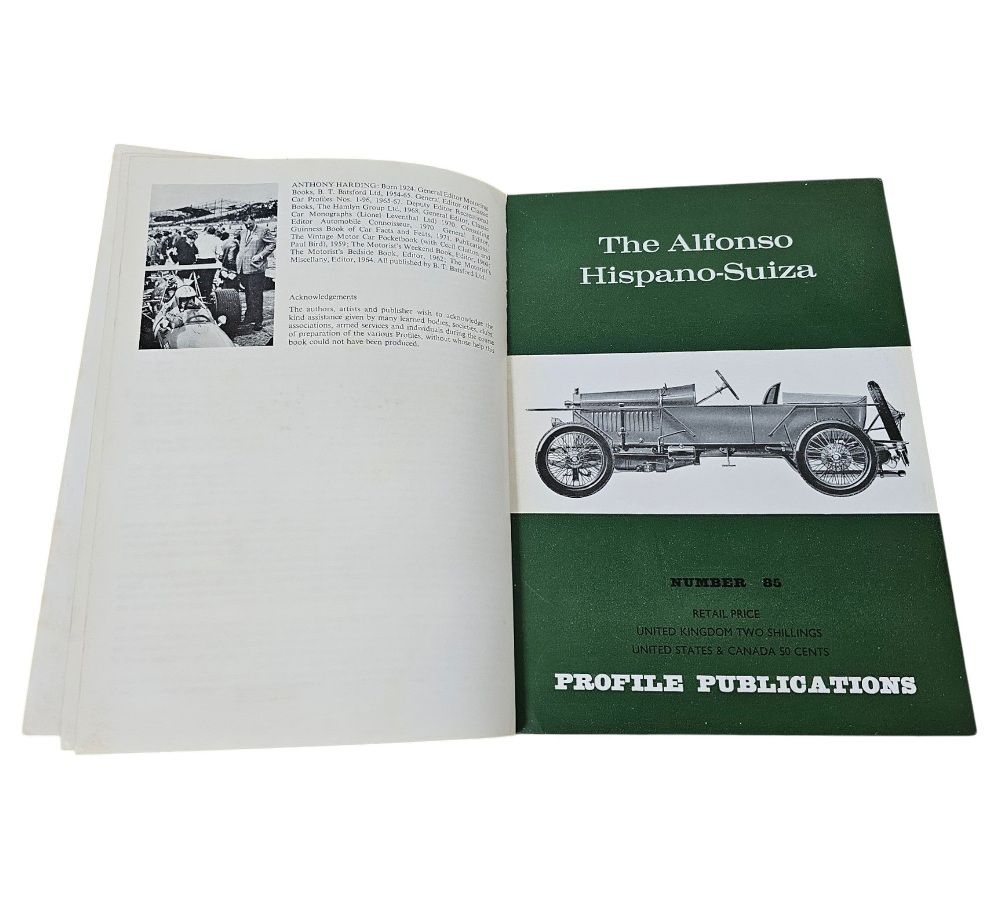 Open book with green header page and vintage car side-profile illustration.