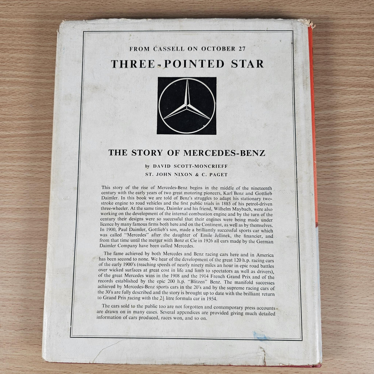 Vintage motor sport hardcover book open to title page with Mercedes-Benz logo