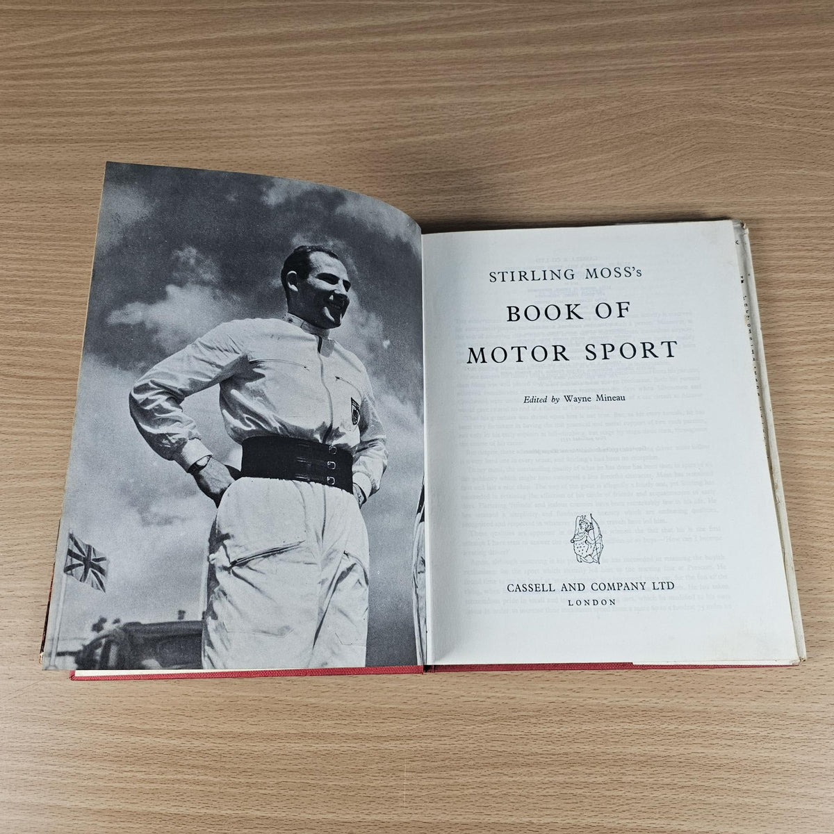 Vintage motor sport hardcover book open; left page photo and right page title text