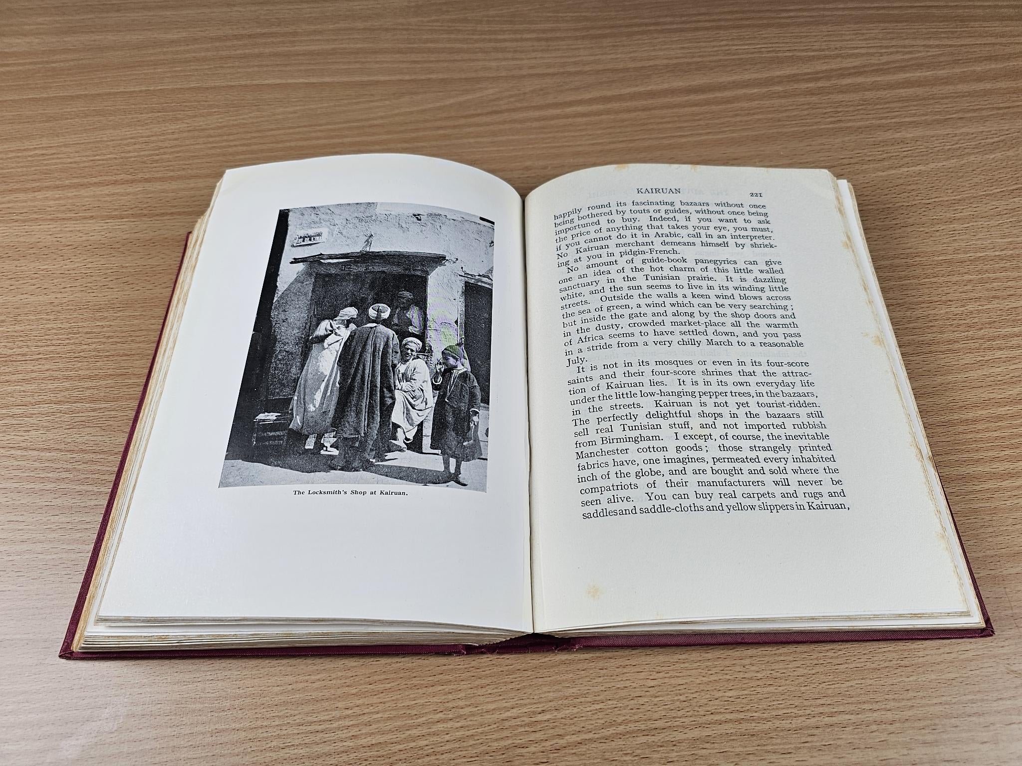 Open book with printed text and a black-and-white photo illustration