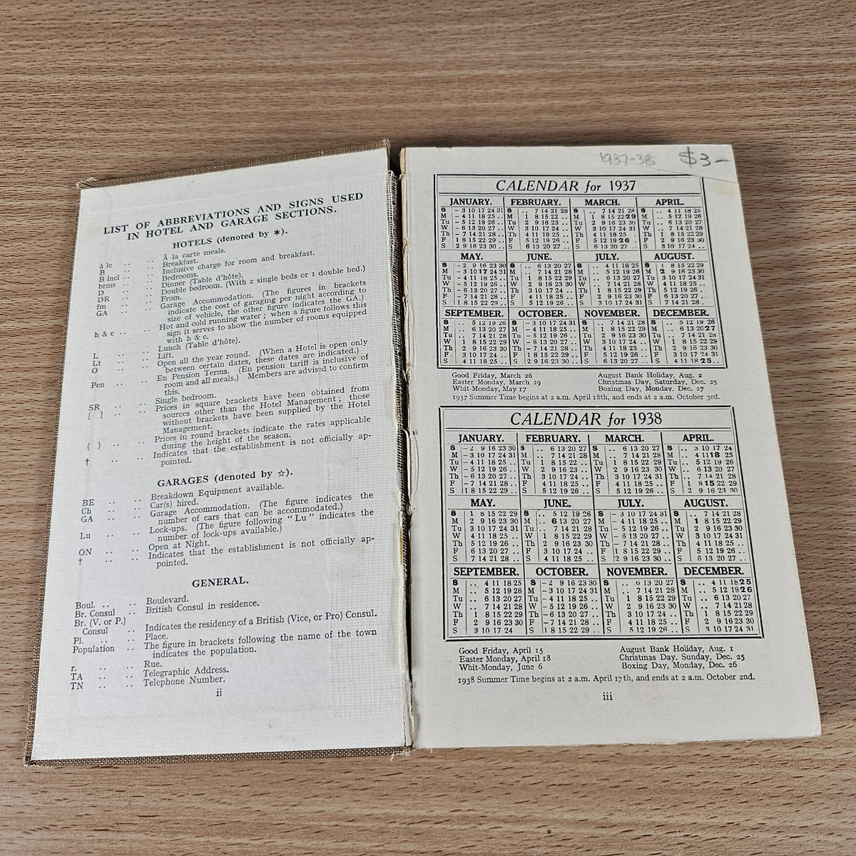 Open vintage AA foreign touring guide showing calendars for 1937 and 1938