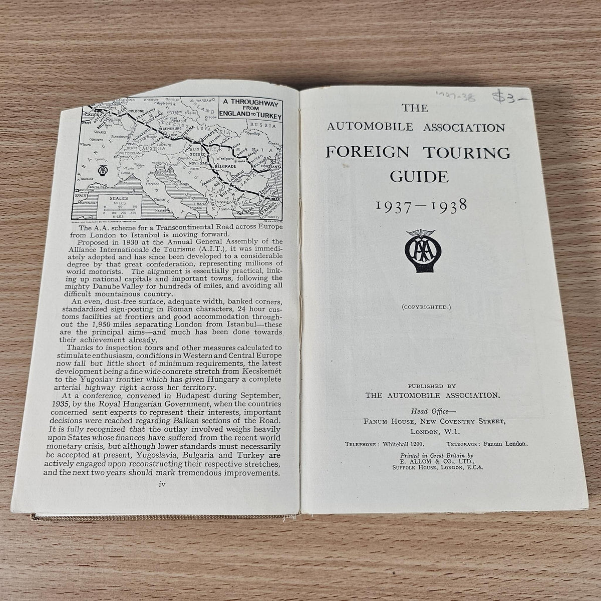 Open vintage AA foreign touring guide with map page and guide title 1937-1938