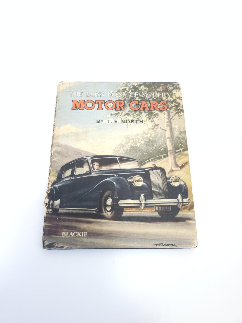 Hardcover book with motor cars cover showing a black vintage car, title near top