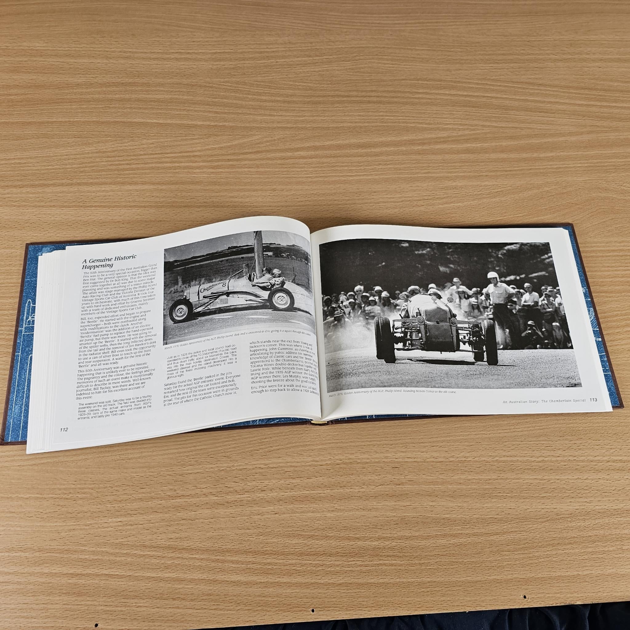 Open book with black-and-white car photo and group photo on right page
