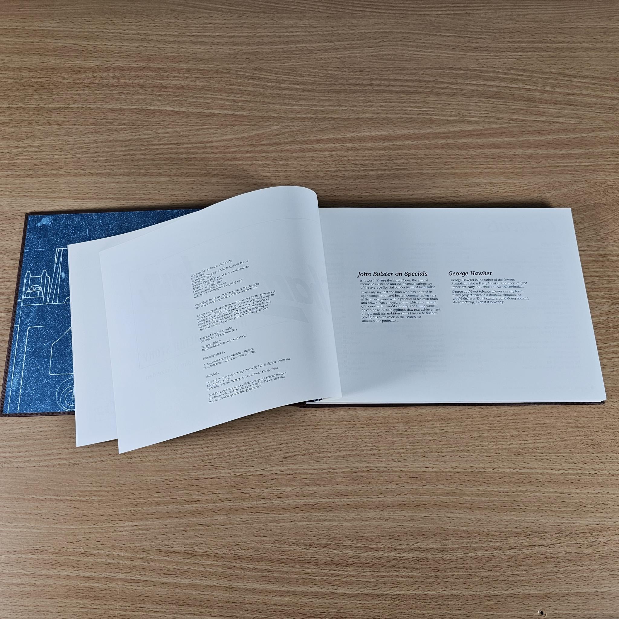 Open book pages with author names and printed article text