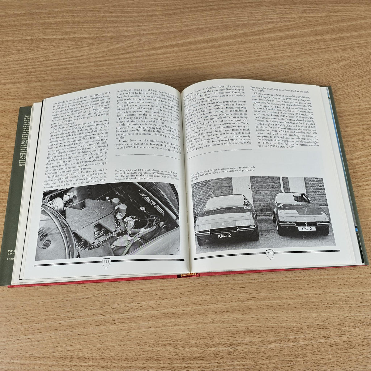 Ferrari road car book, open spread with engine close-up and classic car photos.