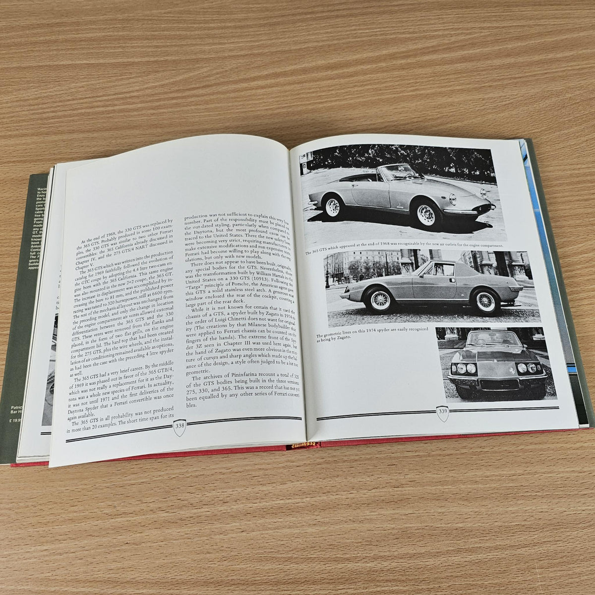 Ferrari road car book, open pages with black-and-white side views and car photos.