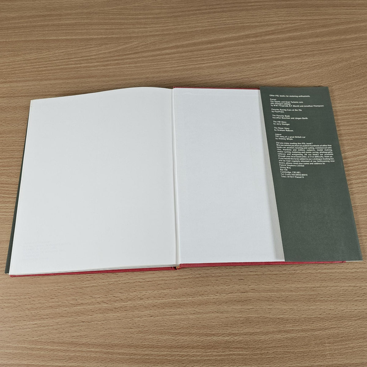 Ferrari road car book, open blank pages with green back cover and text list.