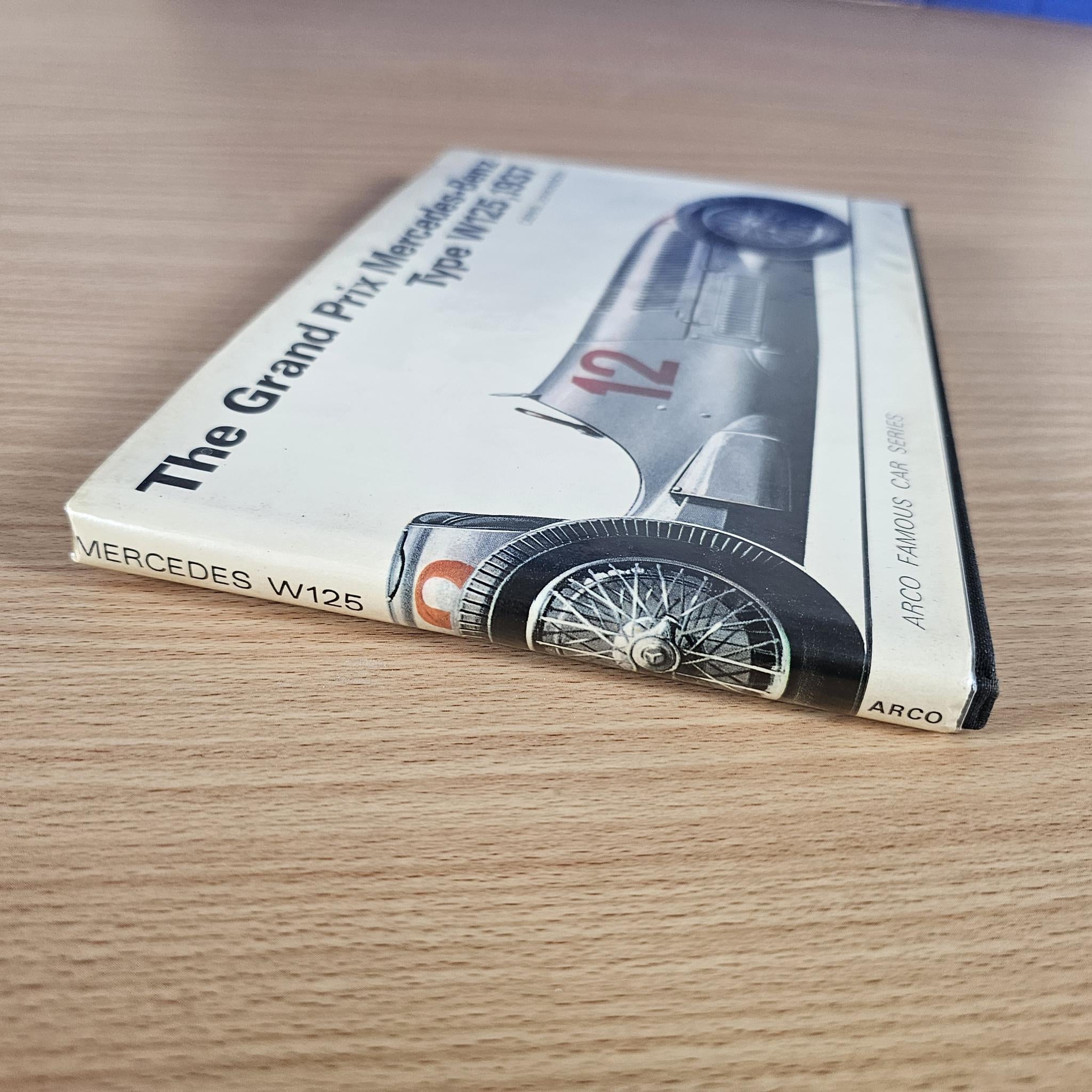Race car book showing the spine and corner with the Mercedes-Benz Type W125 cover art