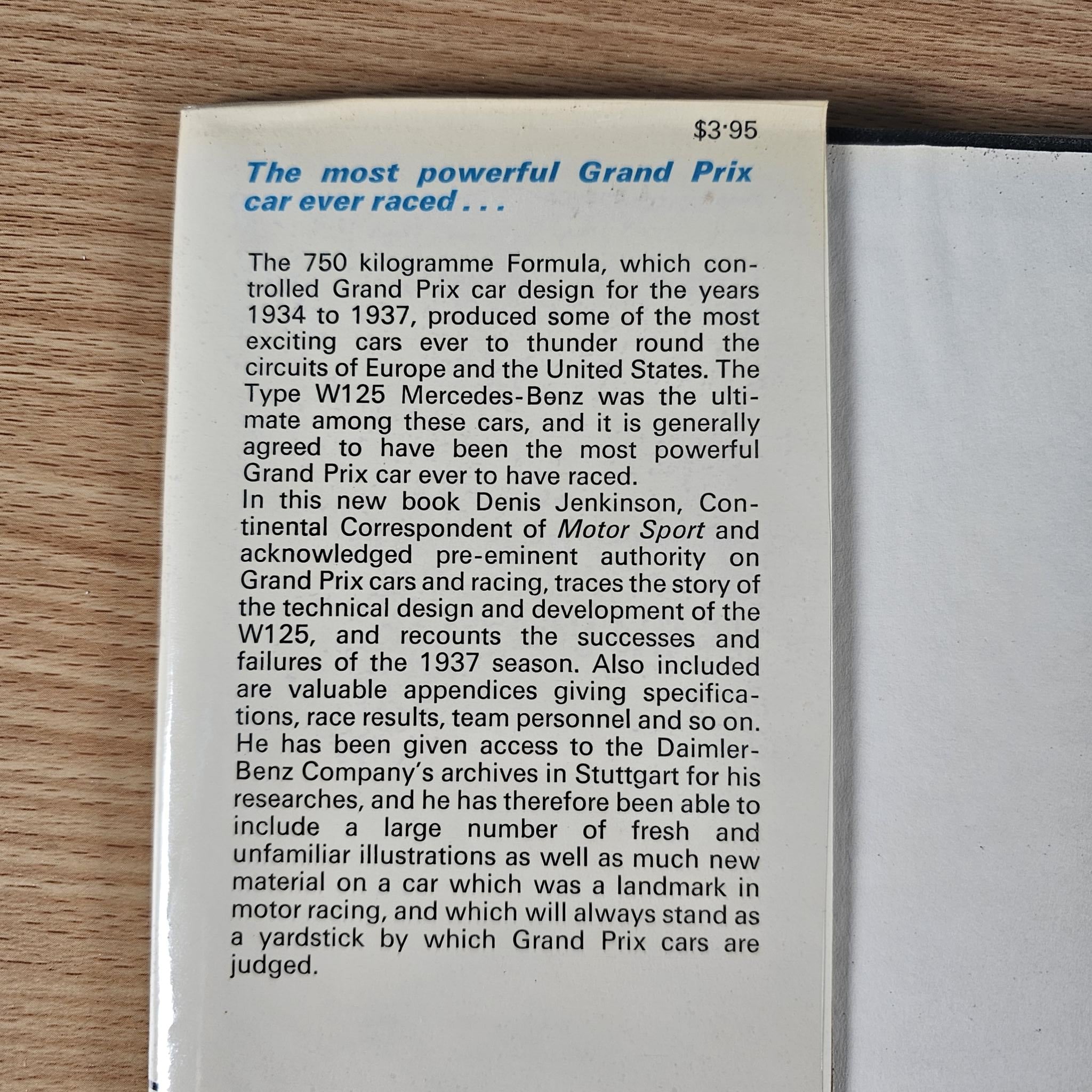 Race car book closed-up page with bold quote at top and paragraphs of text