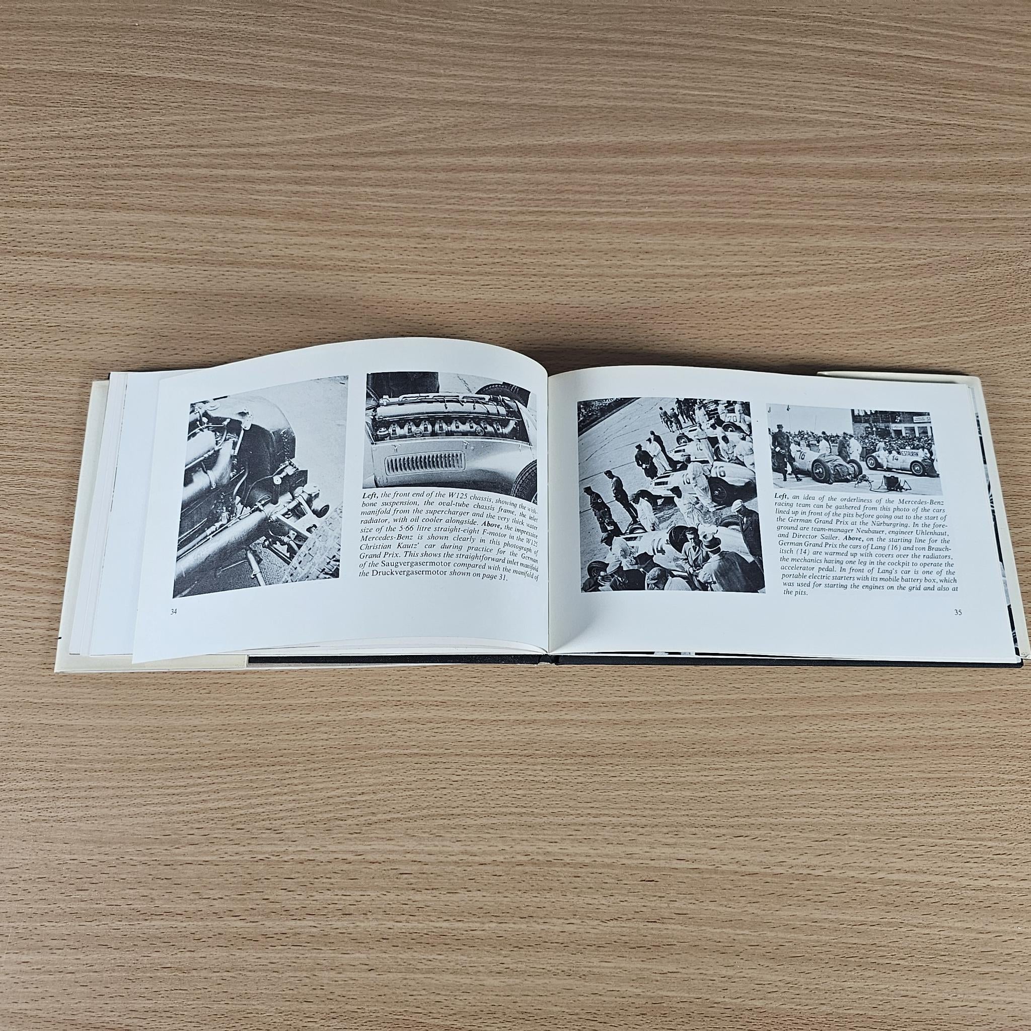 Open race car book spread with several black-and-white photos and captions