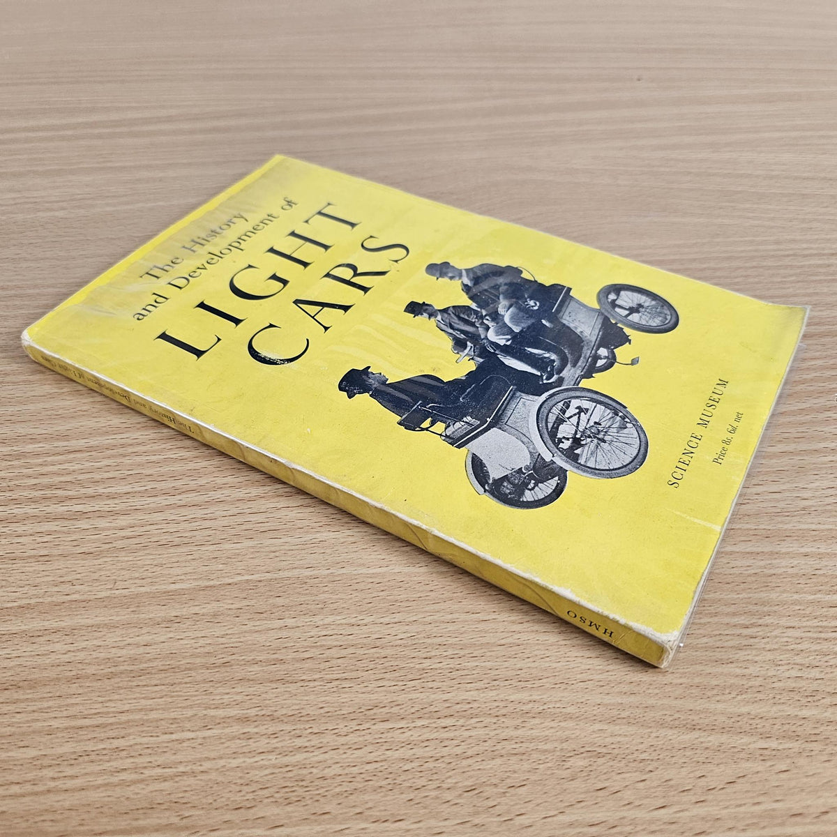 Yellow paperback book with motorcycle illustration on cover and large title text