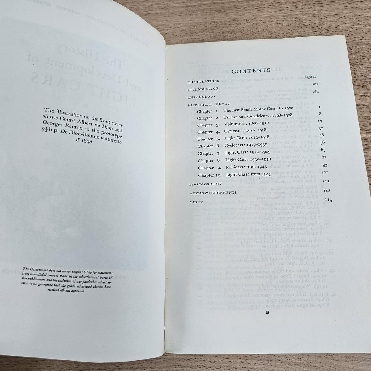 Open paperback book displaying contents list with numbered chapters and page references