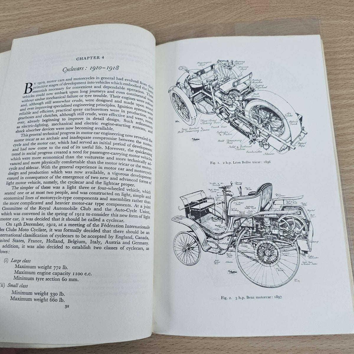 Open paperback book with chapter text and line drawings of motorcycle engine components
