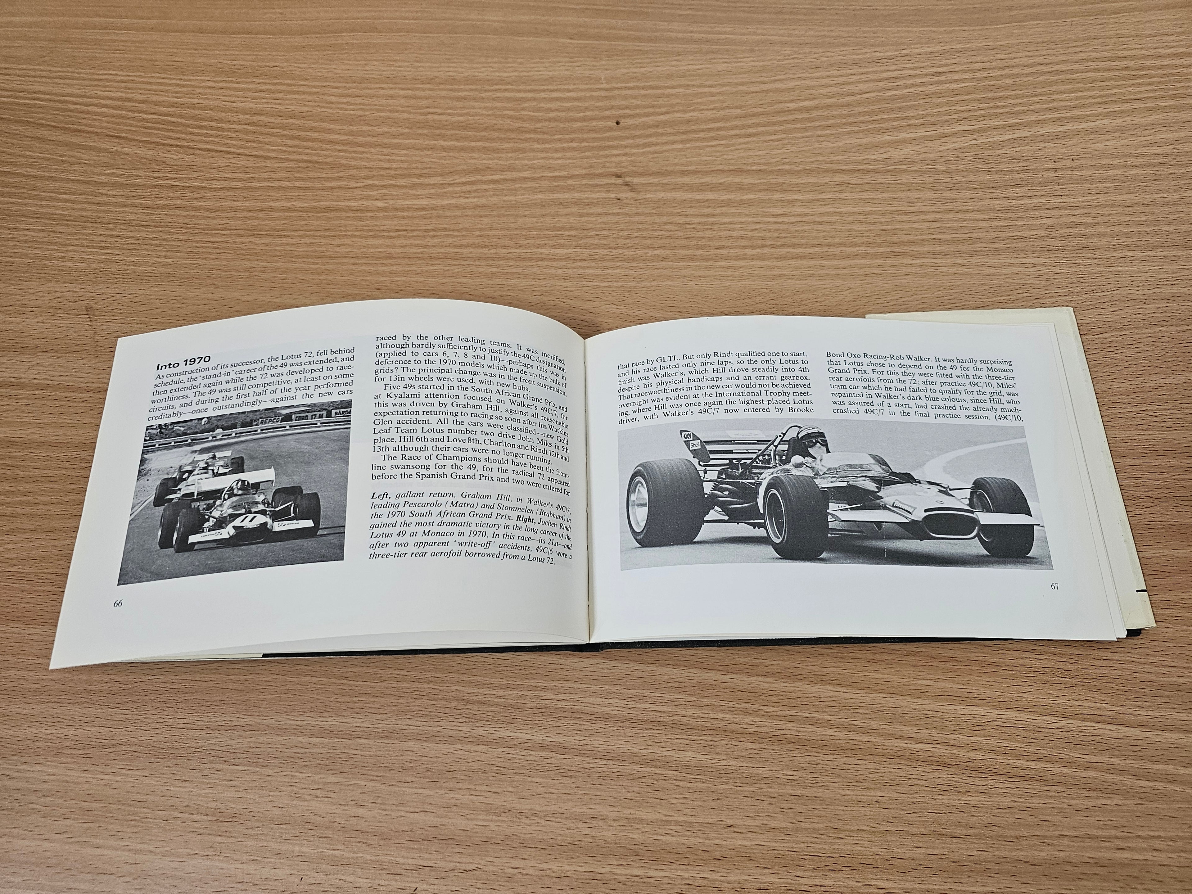 Open book with two-page spread, black-and-white race photos, and printed text
