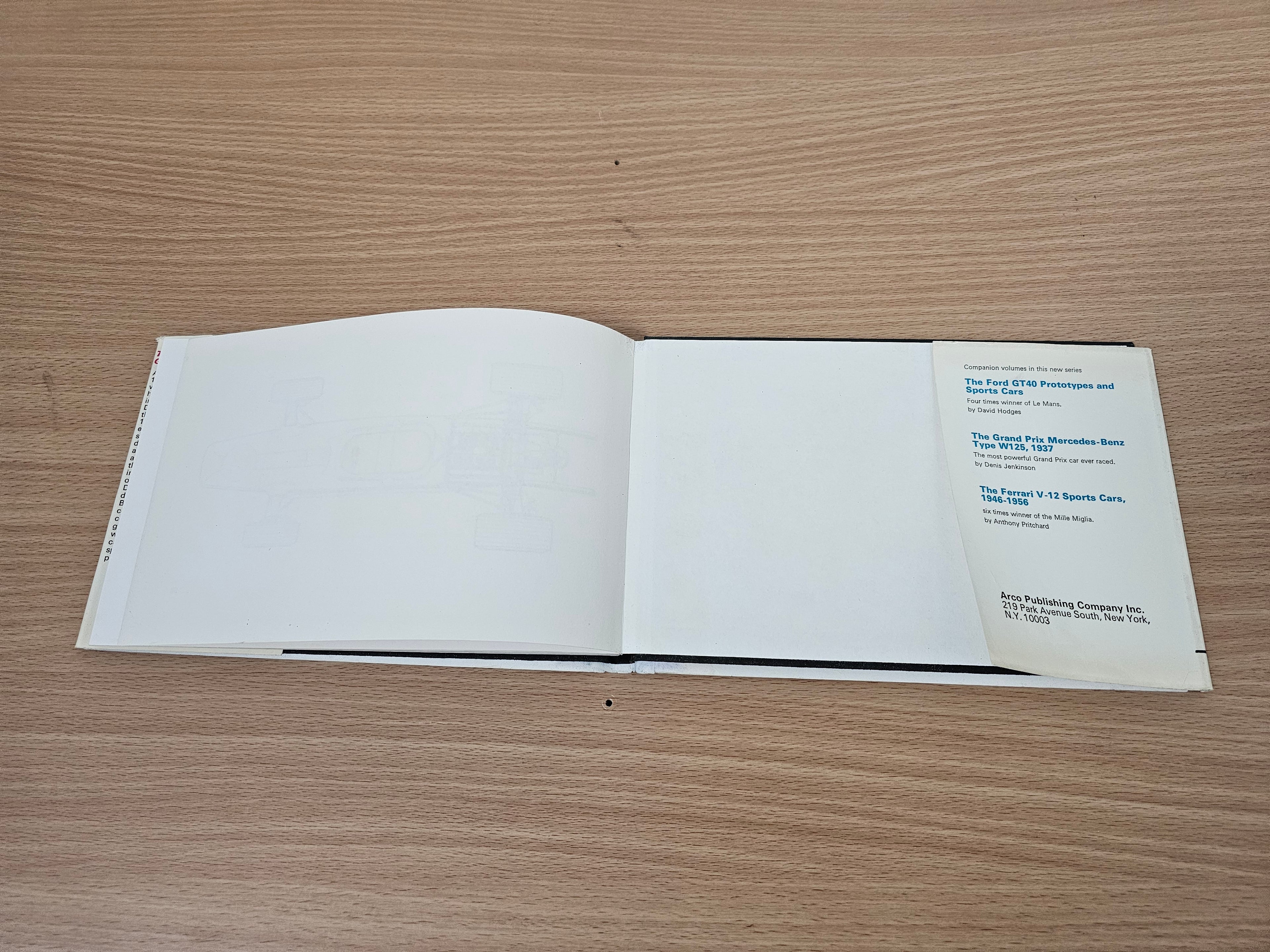 Open book showing mostly blank pages and a right-side text panel