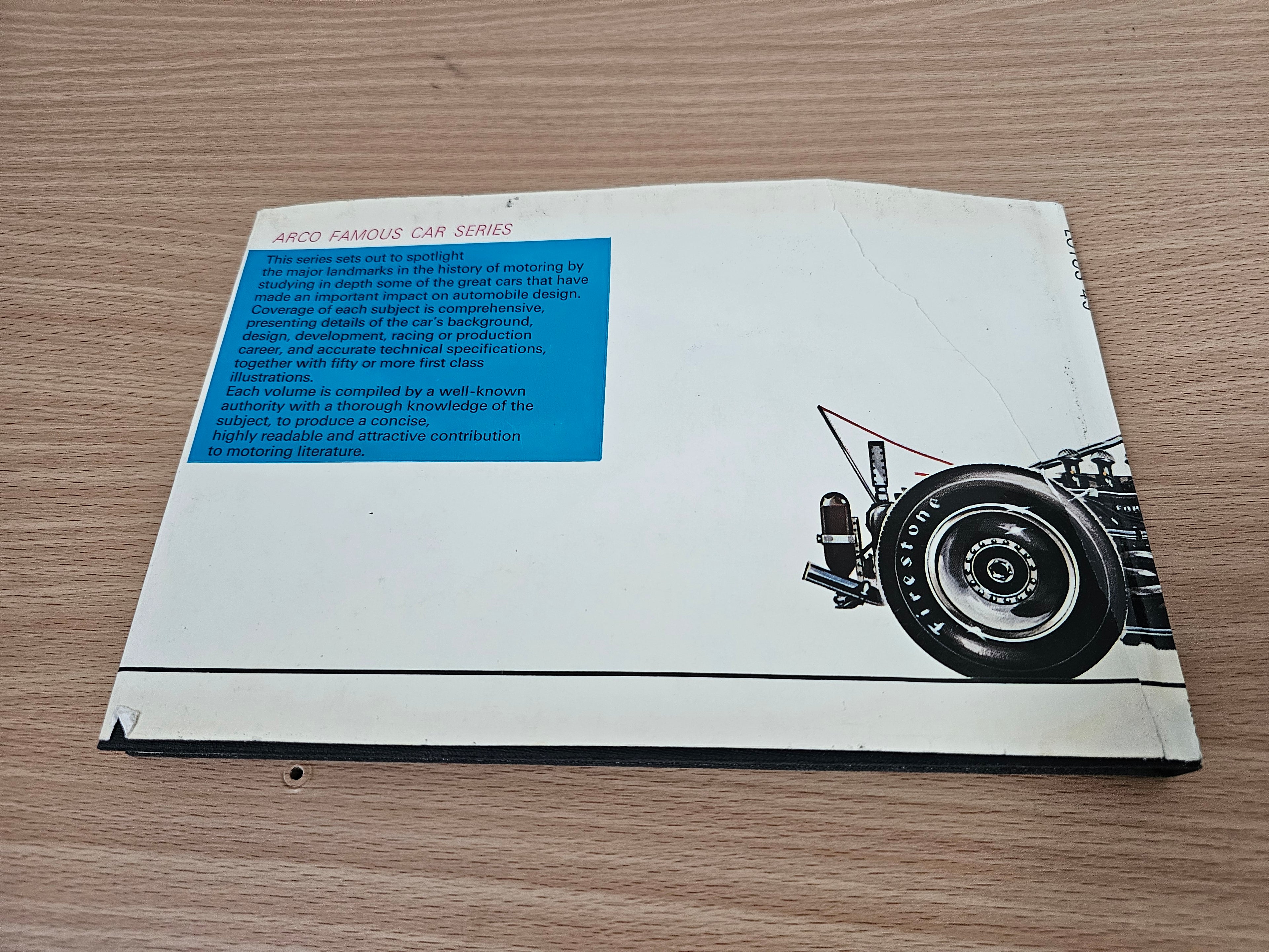 Book back cover with “ARCO FAMOUS CAR SERIES” text block and a race car wheel