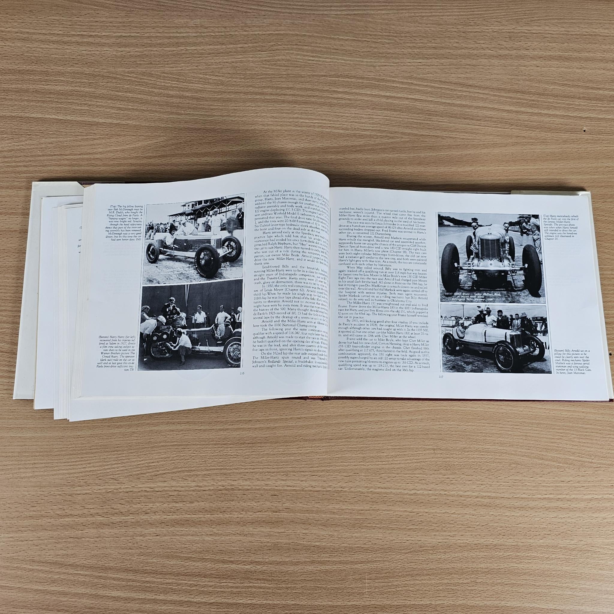 Open history book pages with black-and-white photos and columns of text