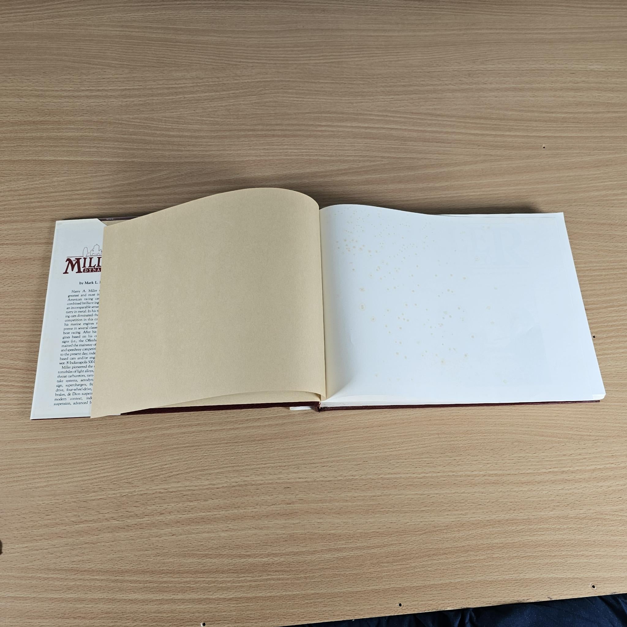 Miller Dynasty history book open with mostly blank pages and small page text