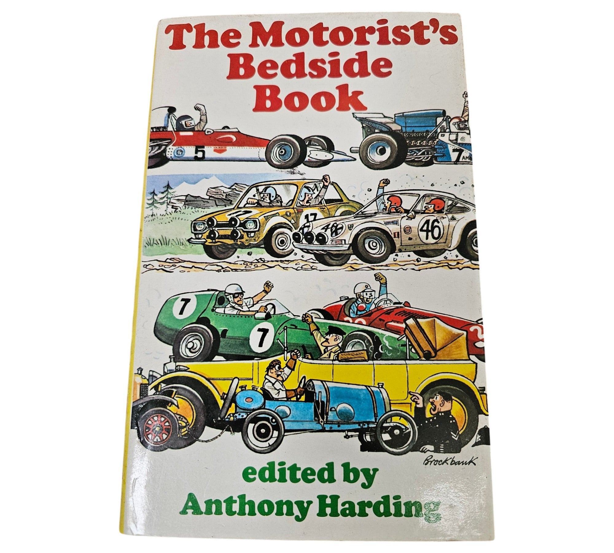 Automotive book front cover showing racing cars and the title "The Motorist's Bedside Book"