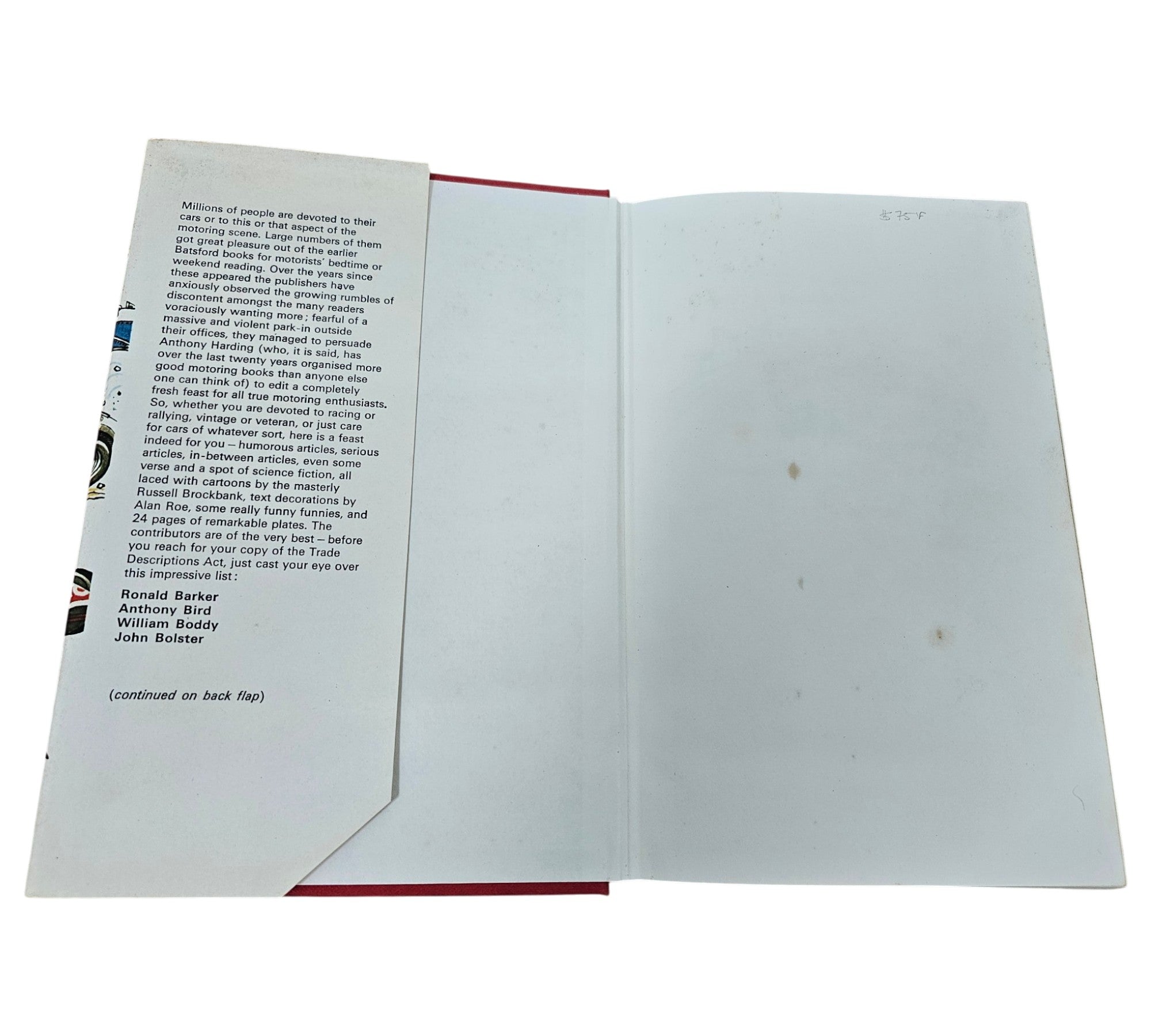 Automotive book opened showing printed text page and blank facing page