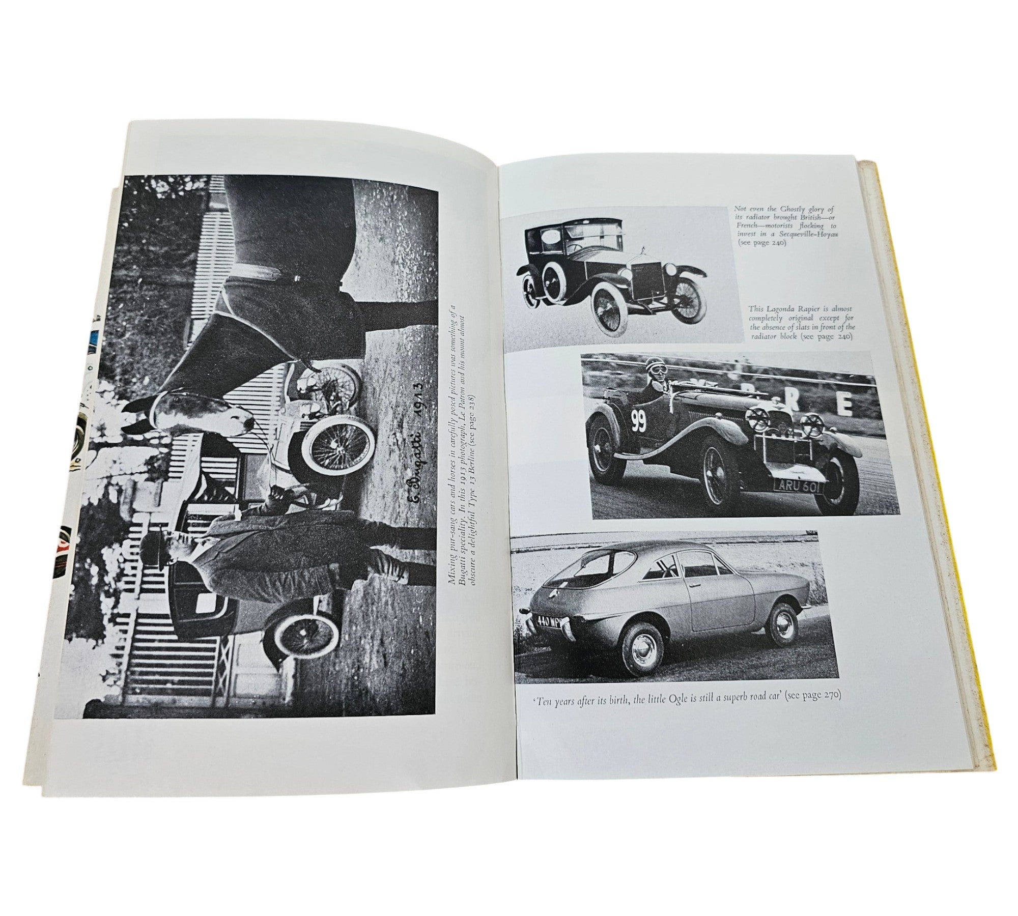 Automotive book open to black-and-white vehicle photos with captions
