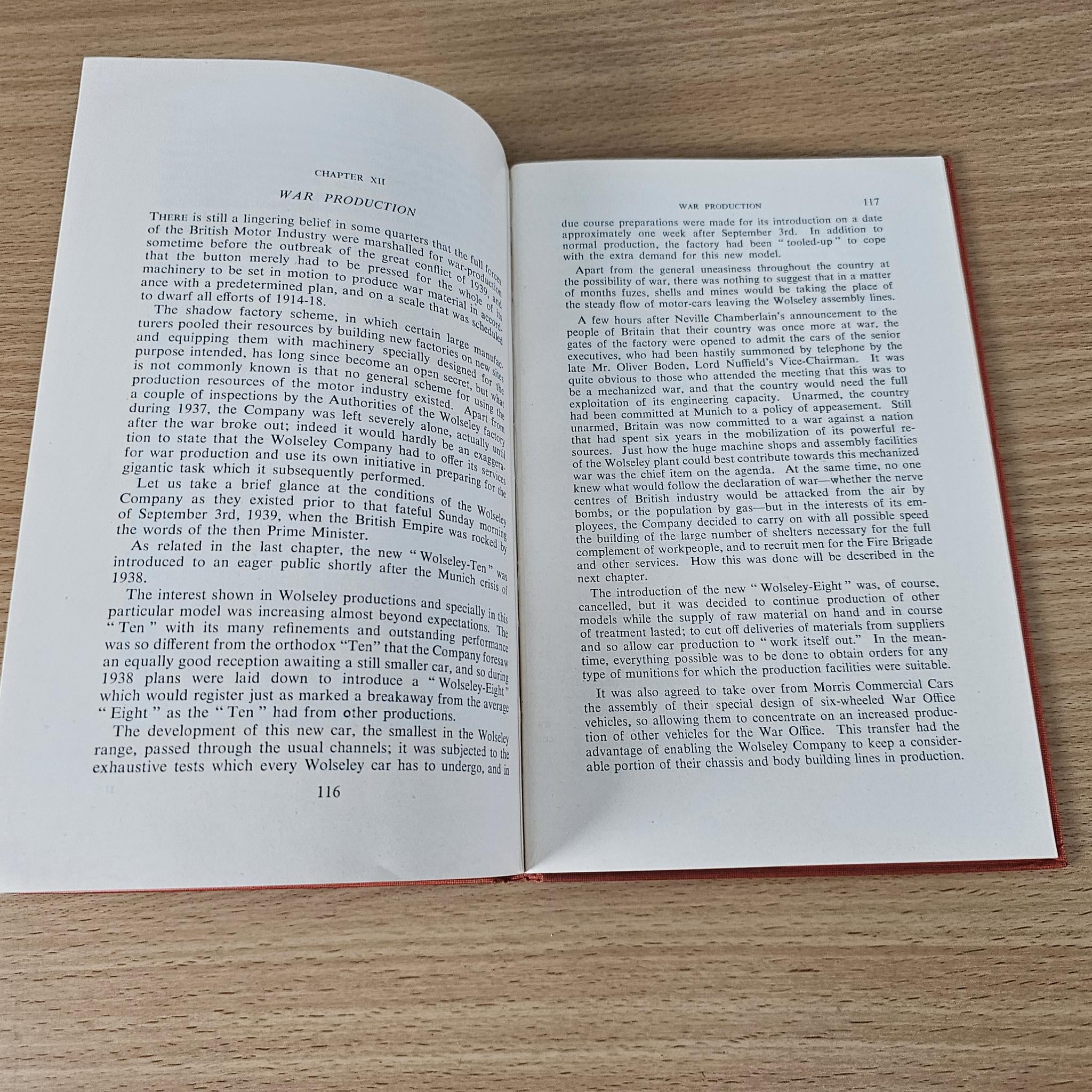 Wolseley hardcover book, open to text pages on motor industry history