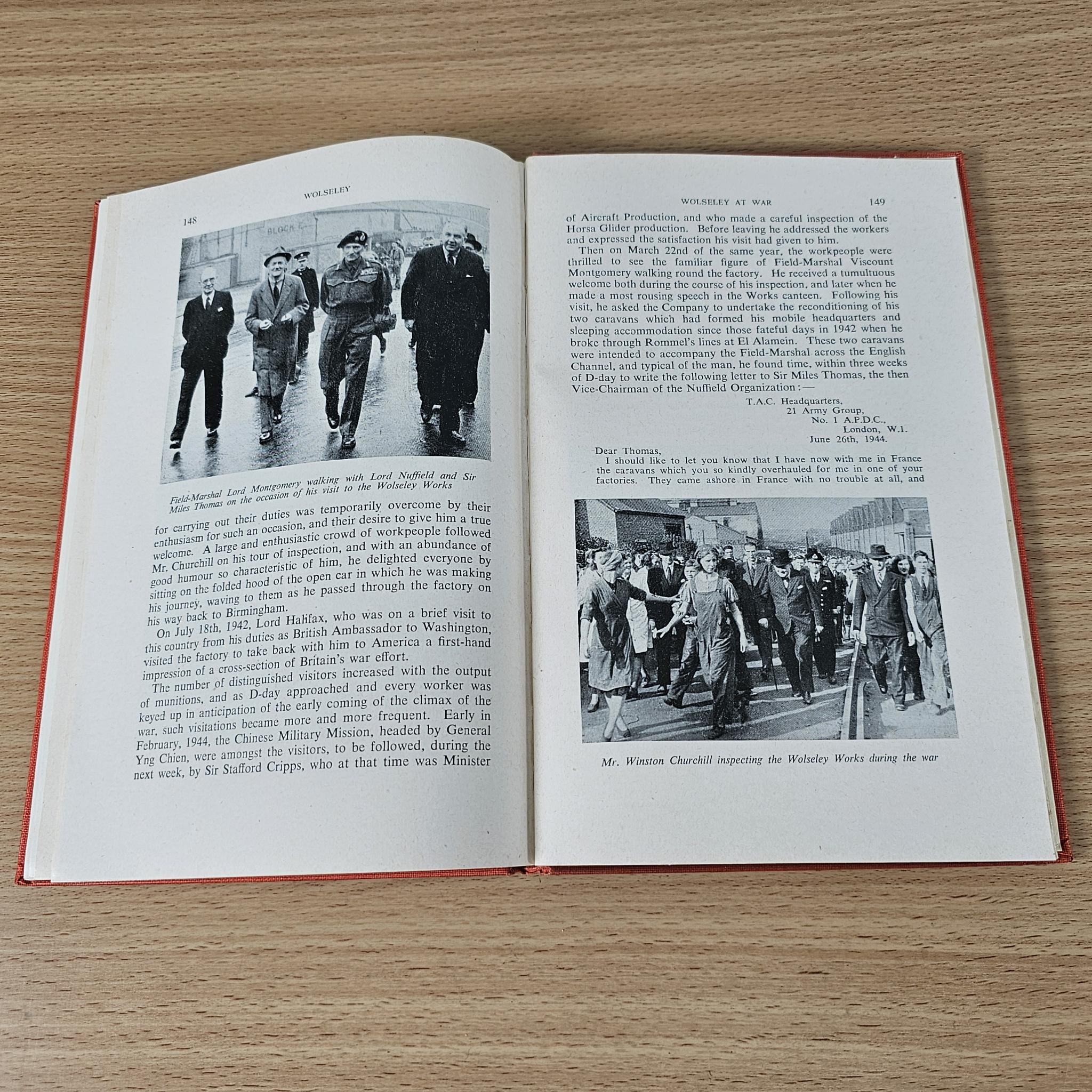 Wolseley hardcover book, open pages with black-and-white photos and captions