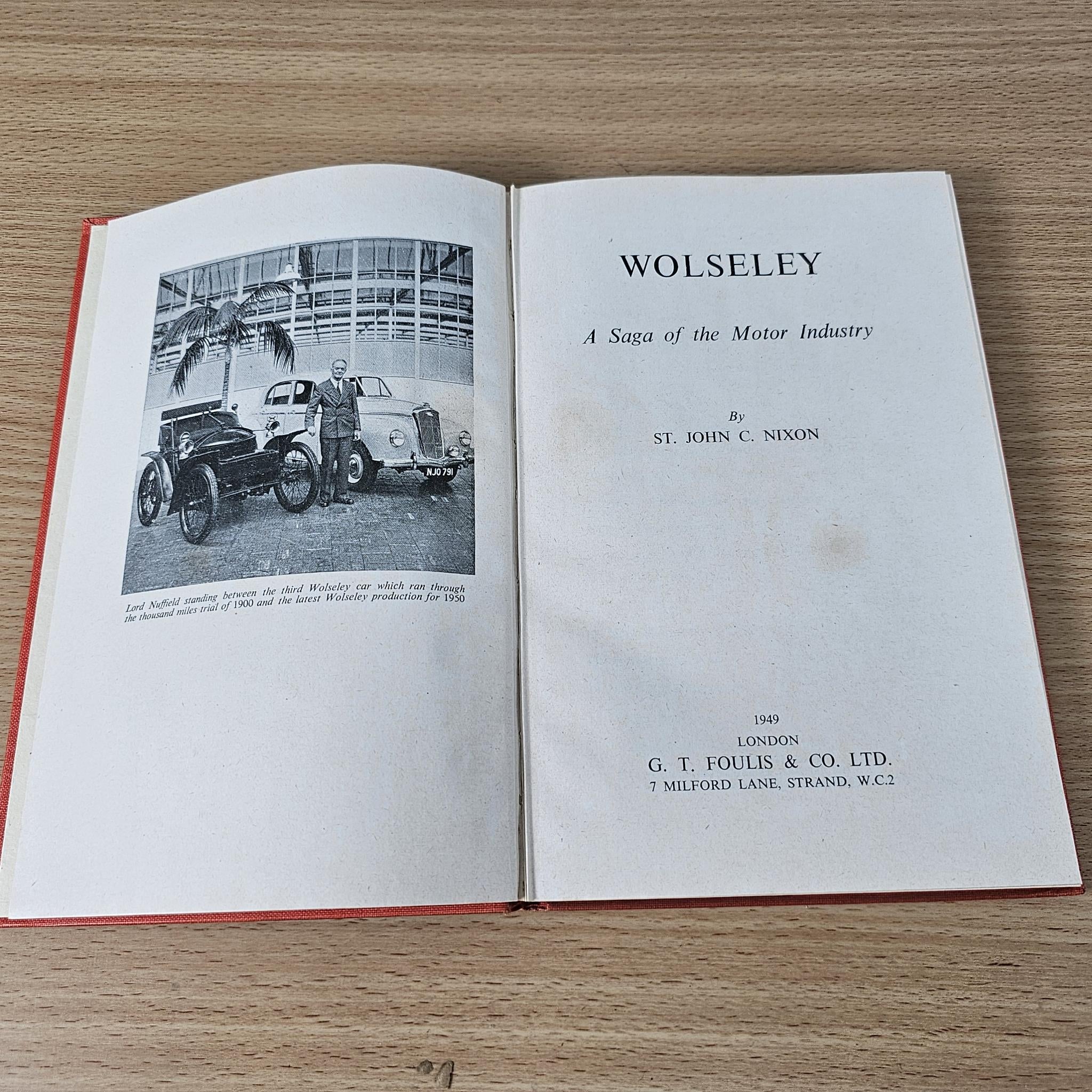 Open book showing a vehicle photo and the title page text with publisher details