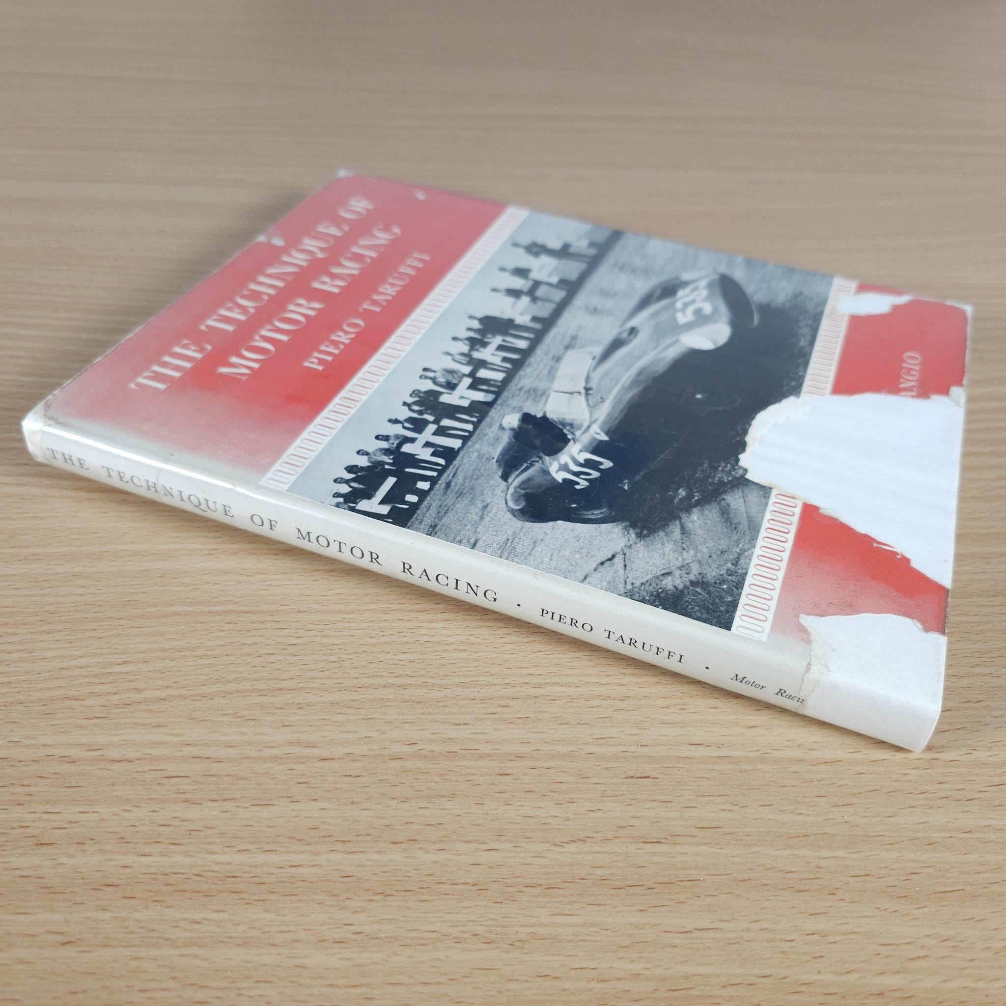 Motor racing book, red and white spine with author and image on cover, angled