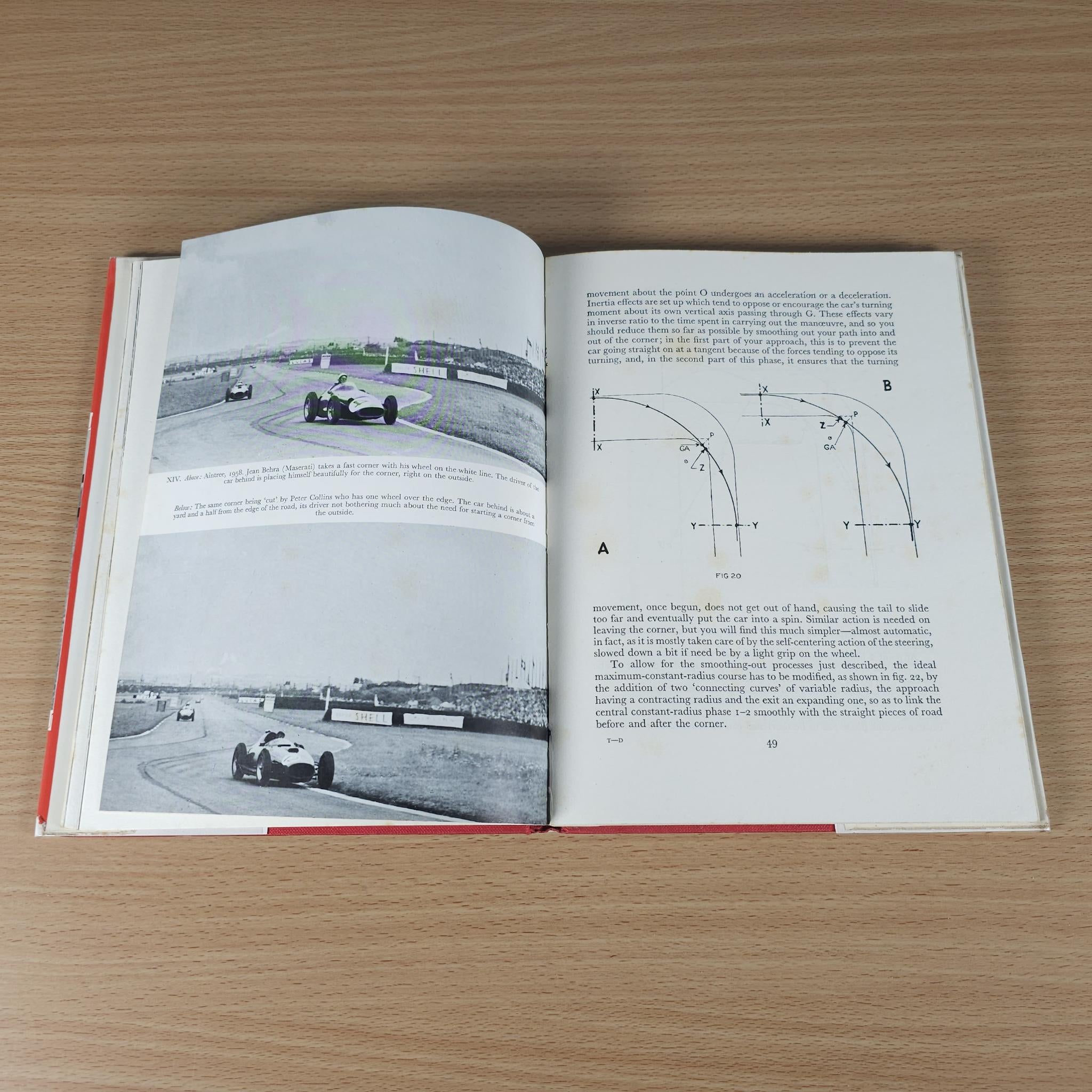 Vintage motor racing book, open pages with photos and line diagrams.