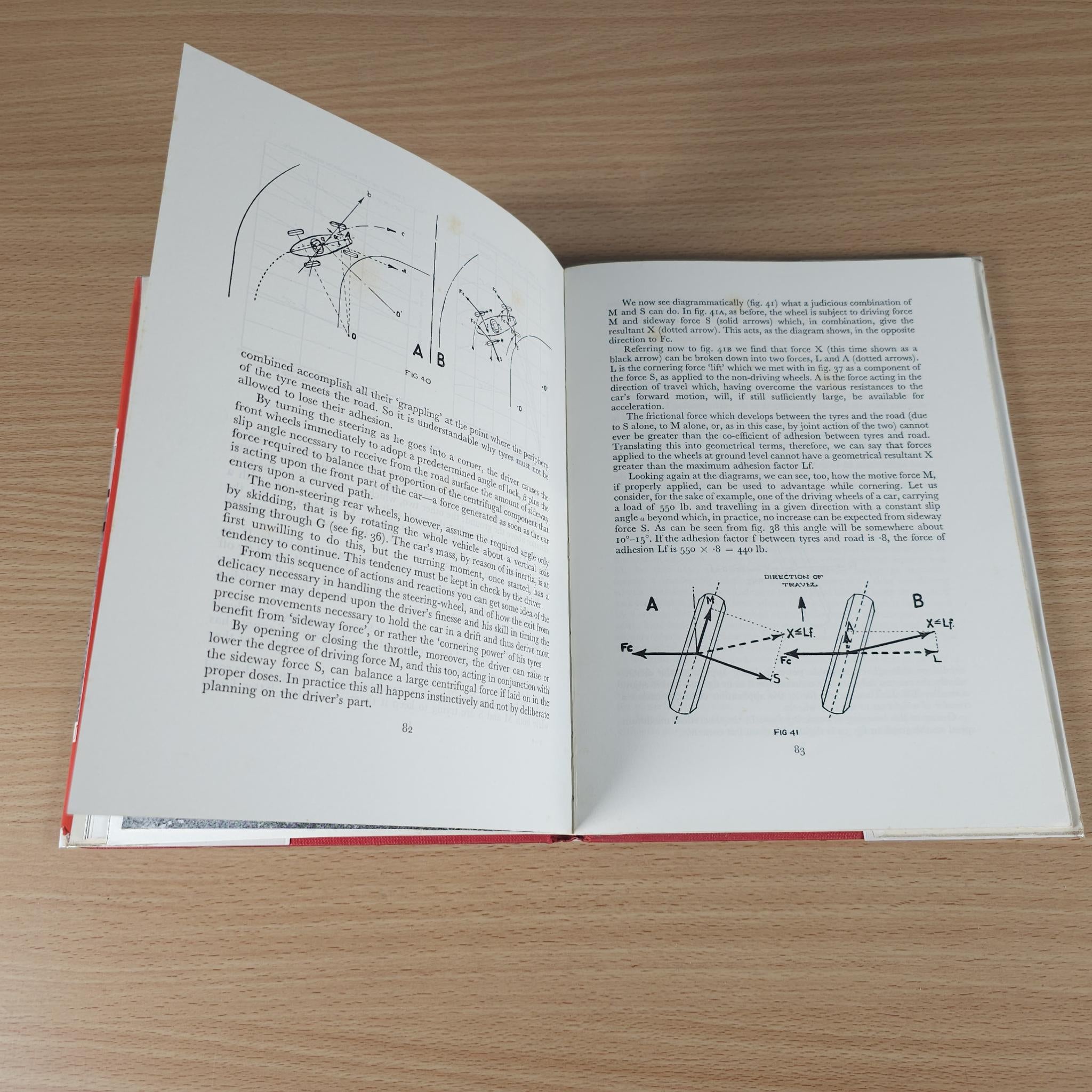 Vintage motor racing book, open spread with vehicle geometry handling diagrams.