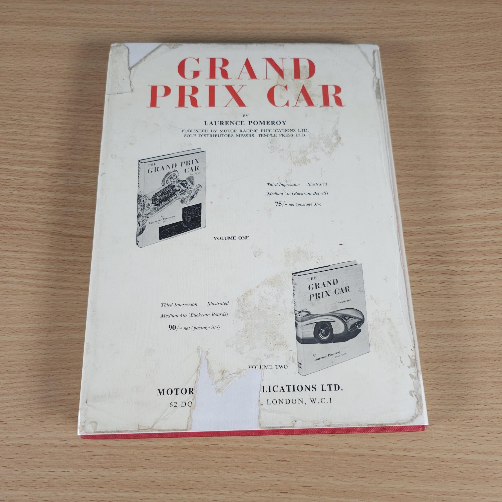Vintage motor racing book cover with red title text and small car images.