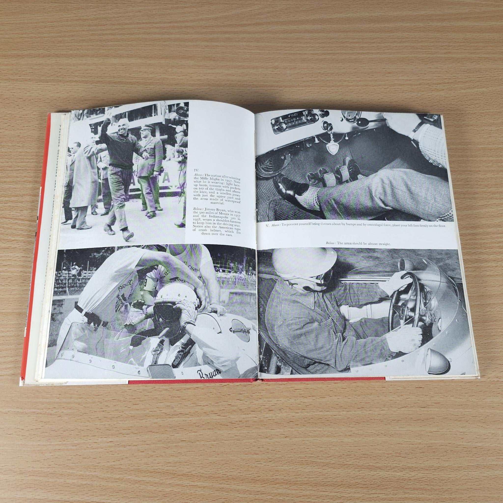 Open motor racing book with black-and-white photos of racing and crew members