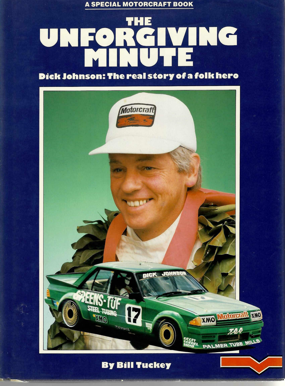 Hardcover racing biography book cover with green car and smiling man in cap