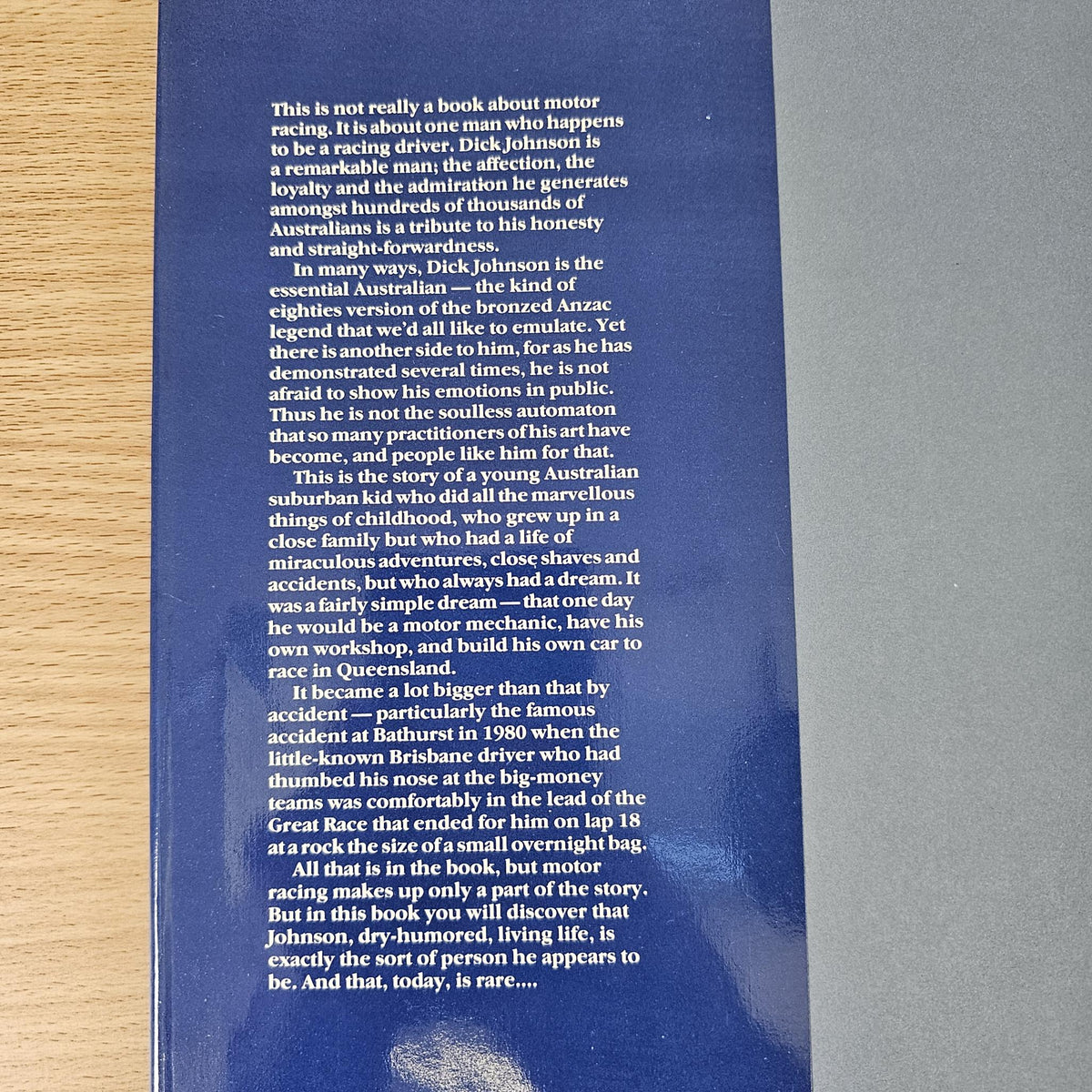 Hardcover book back cover covered with small paragraph text