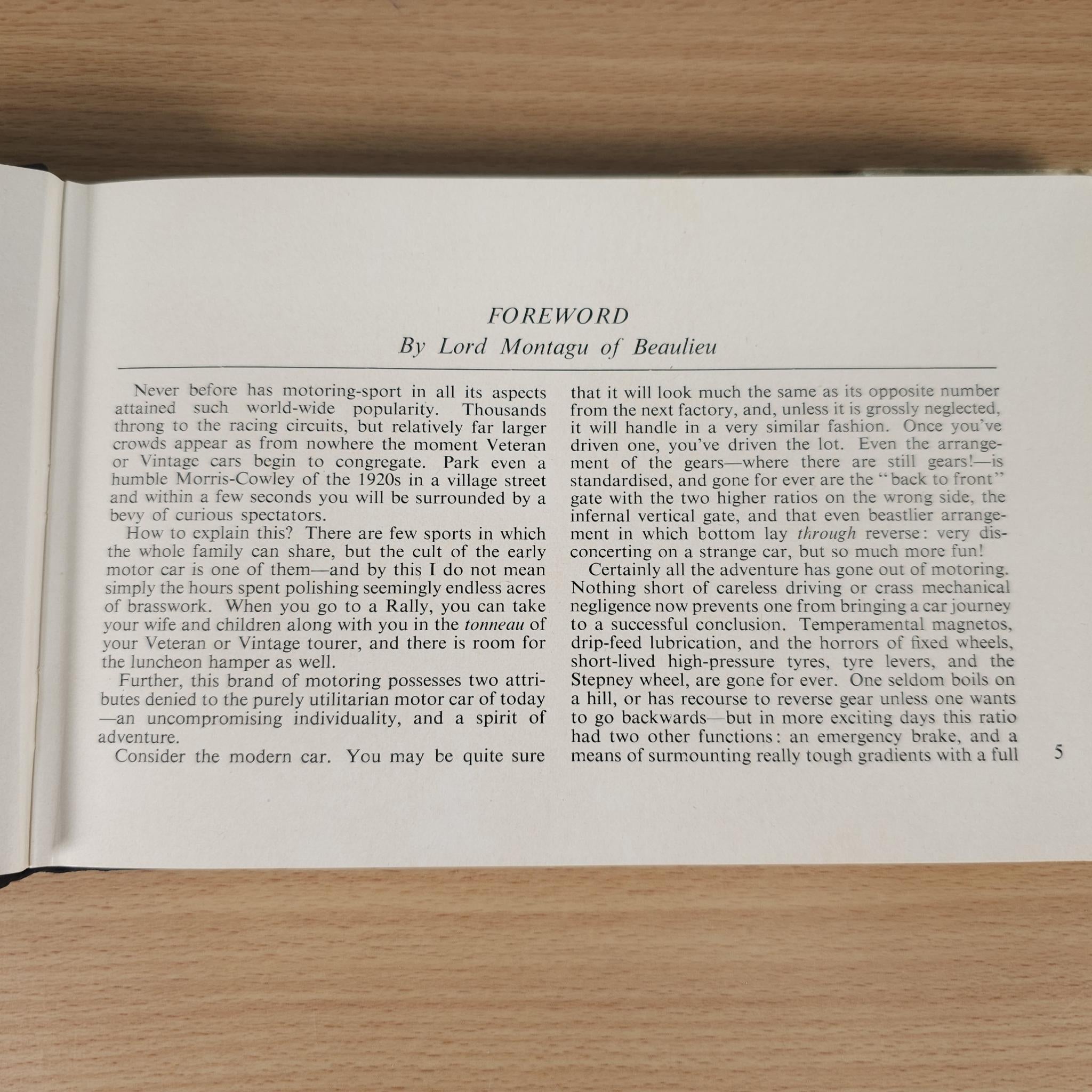 Opened vintage car book with a titled foreword text page