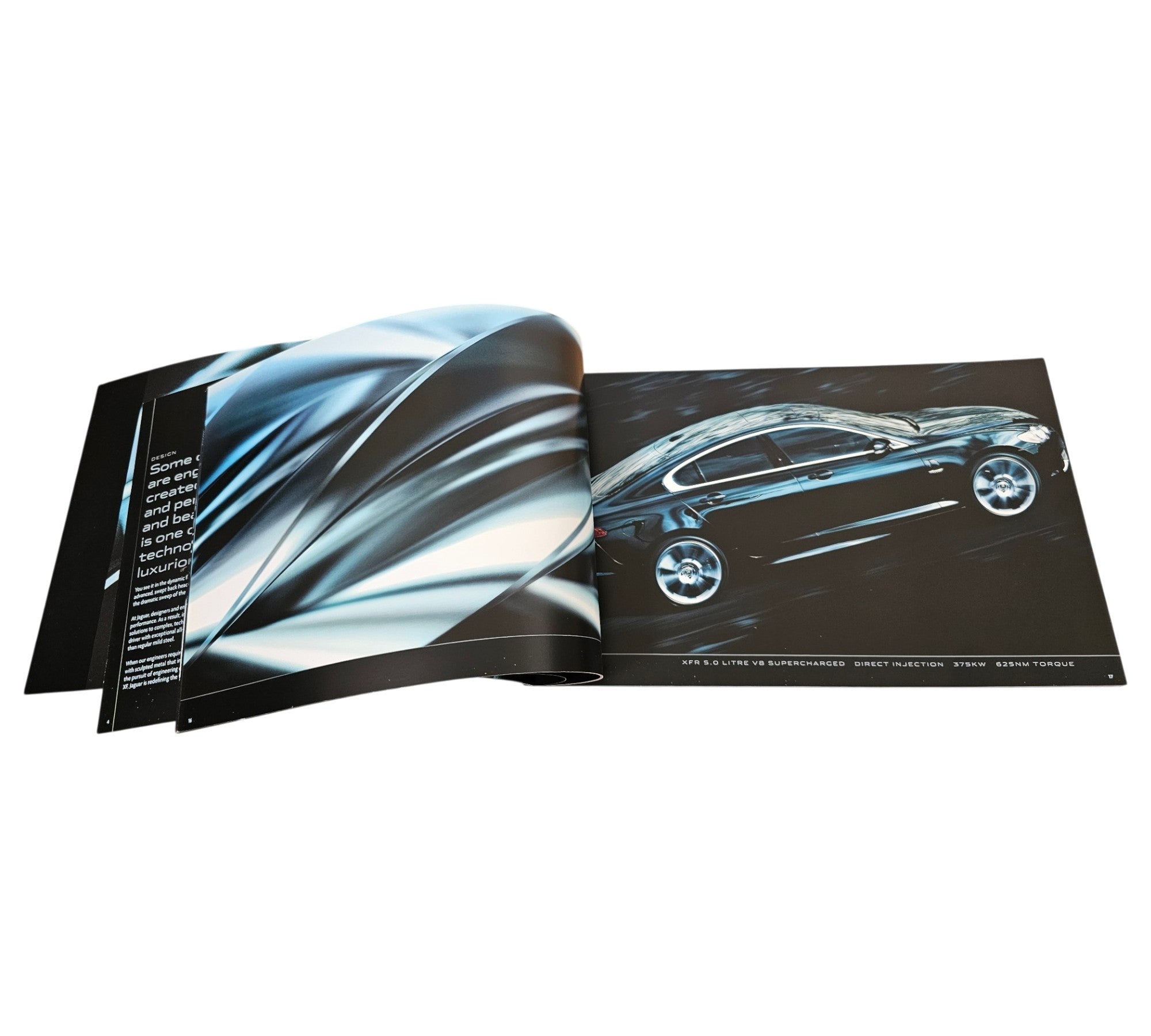 Jaguar XF official portfolio book, open spread with car side profile image.
