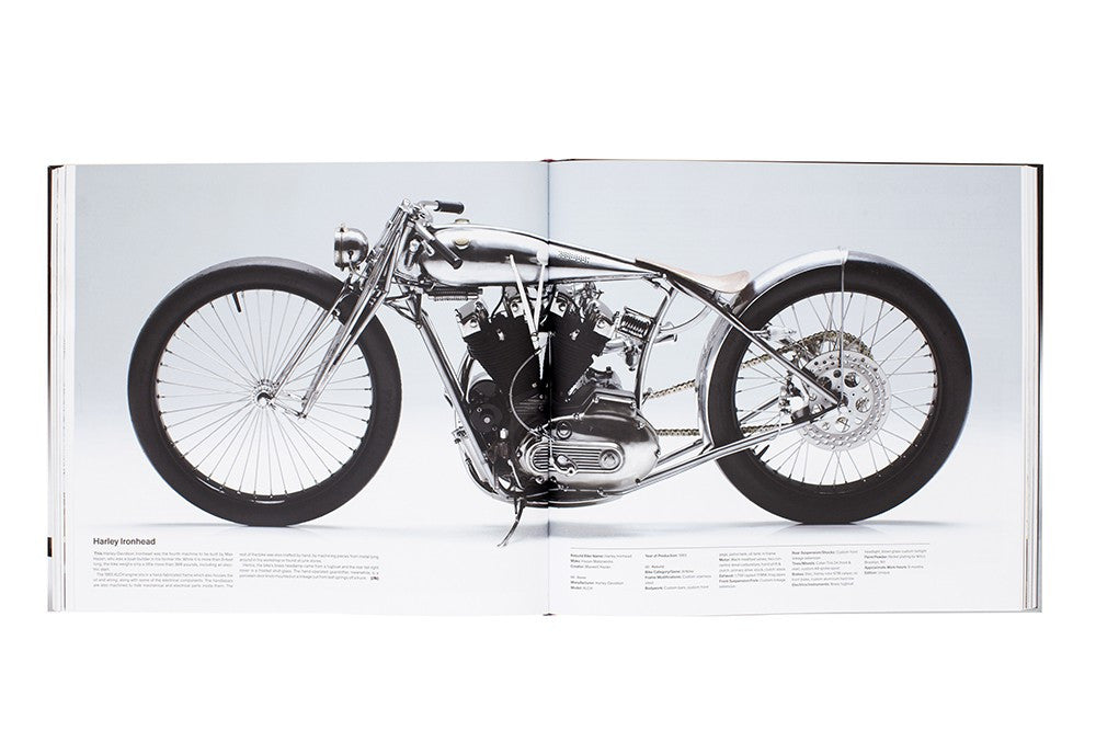 Open motorcycle book page showing a black-and-chrome custom bike in side view