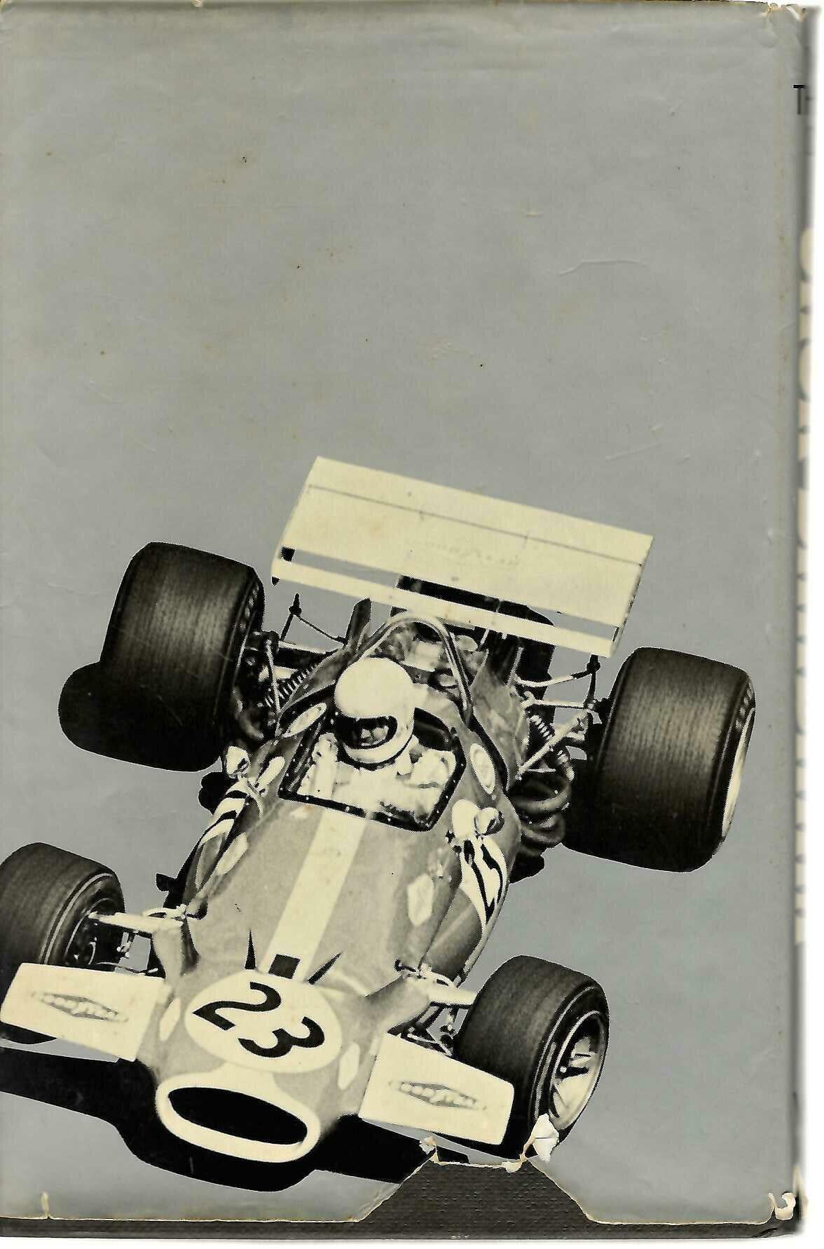 Hardcover autobiography book showing a vintage racing car photo on the back cover