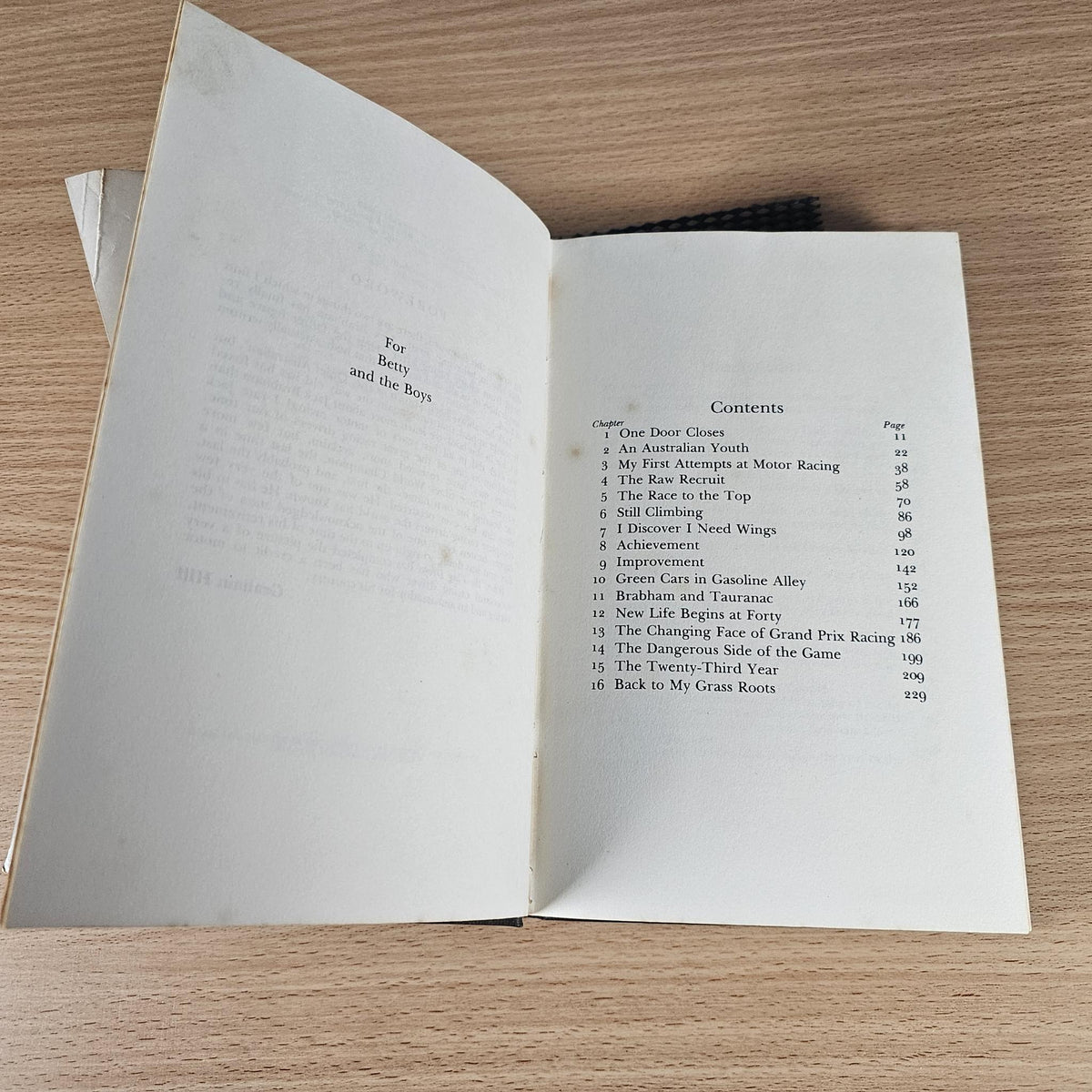 Open hardcover book showing the table of contents page with headings and page numbers