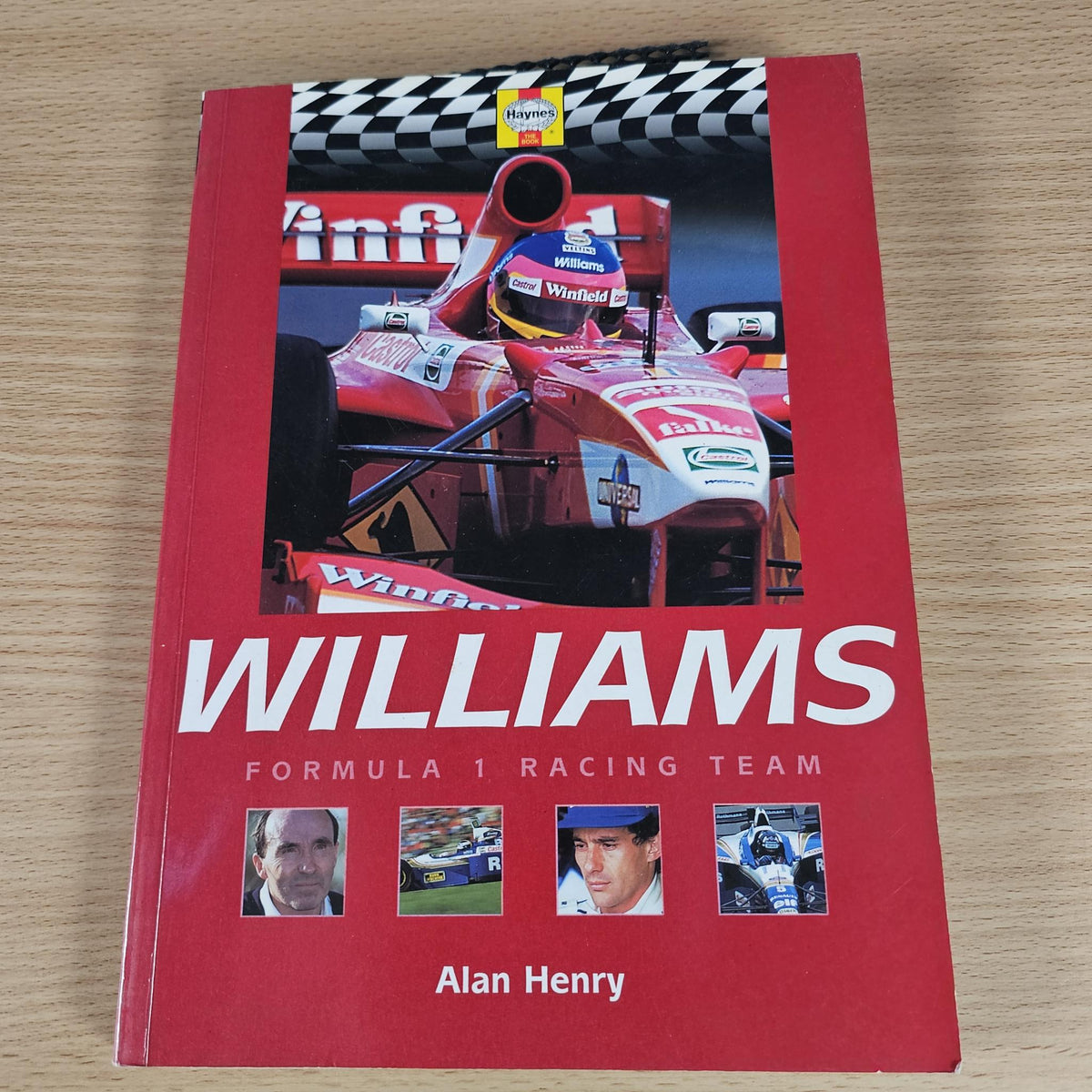 Red book cover with large WILLIAMS title, racing car photo, and Alan Henry name