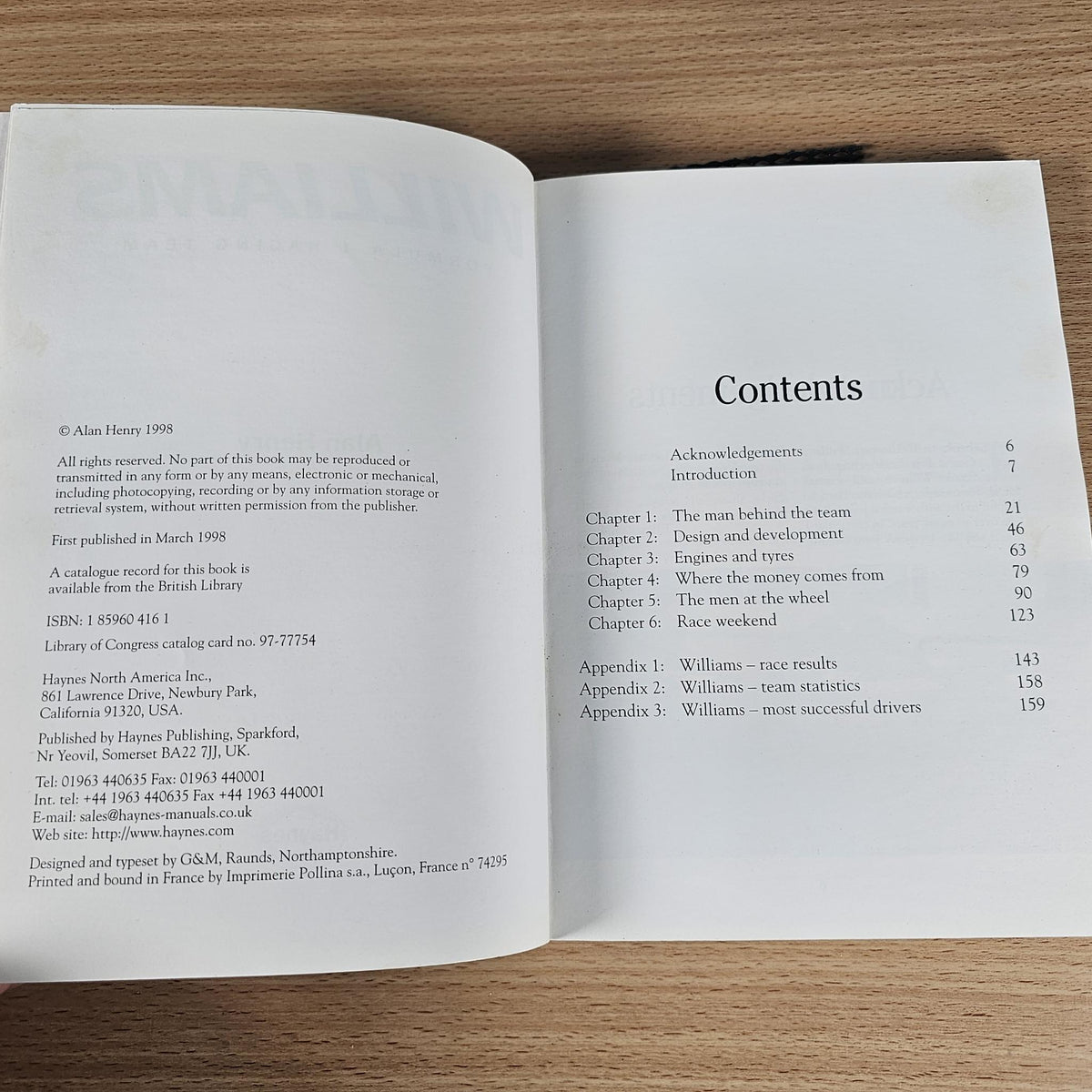 Open book with credits page and Contents list on two sides, black text on white